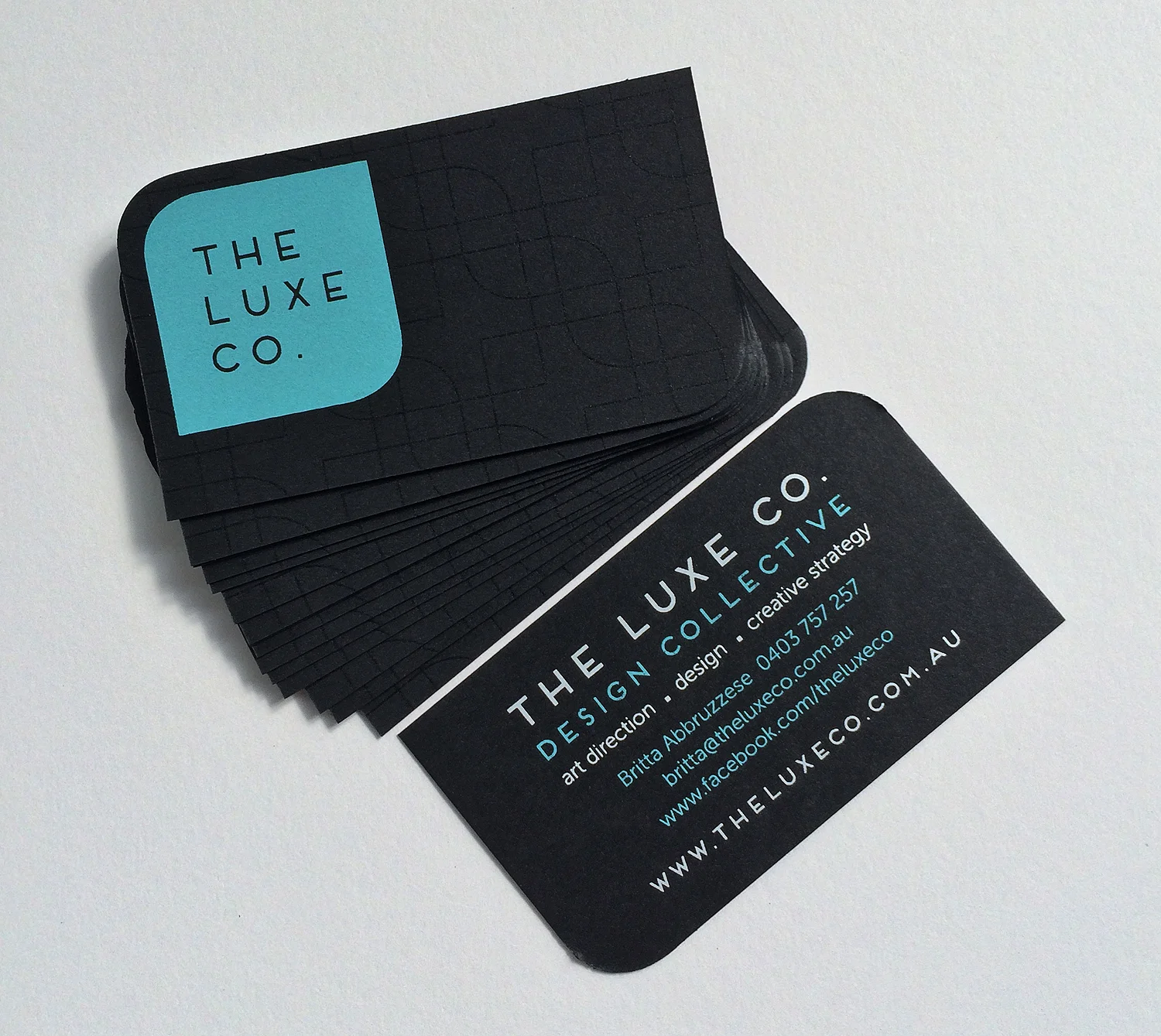 2/2 screen printed business cards on neenah epic black paper. Clear gloss spot ink. Two corners rounded.