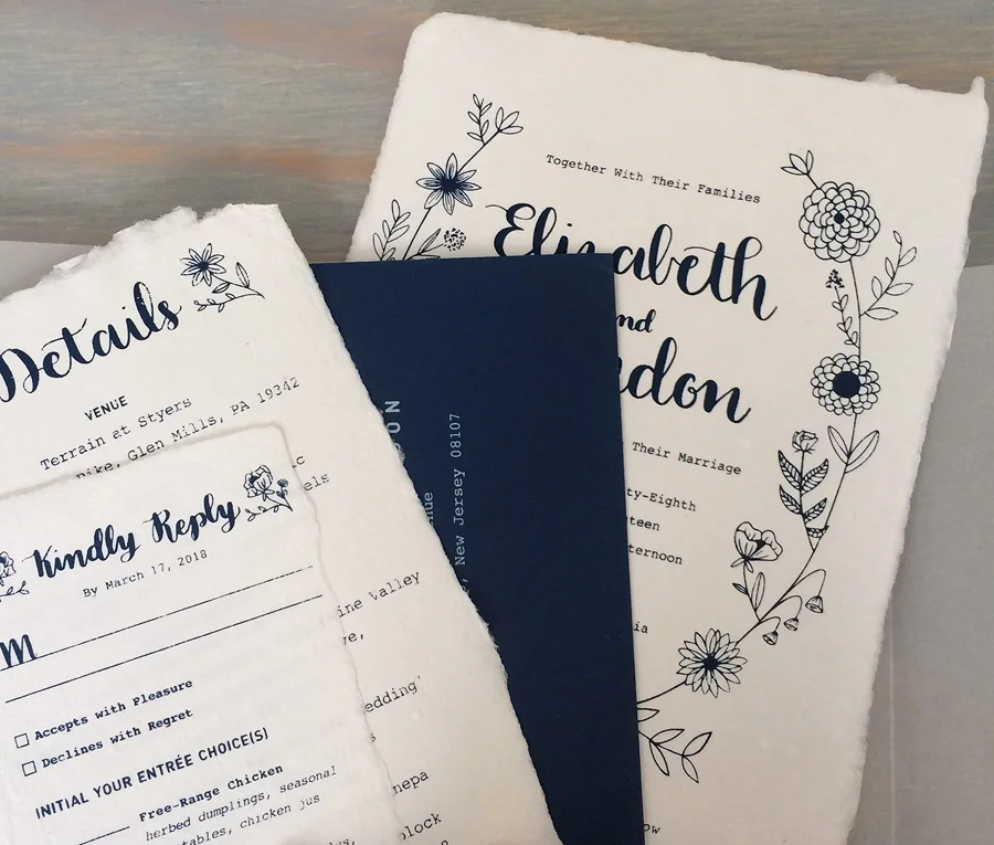 1 color screen printing on in house custom made cotton rag paper with a natural deckle. Screen printed white ink envelopes.