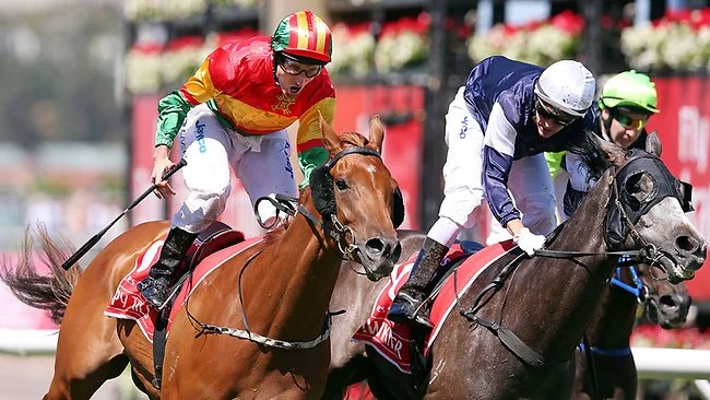 Happy Trails edges out Fawkner in the Group 1 Emirates Stakes (1600m) at Flemington