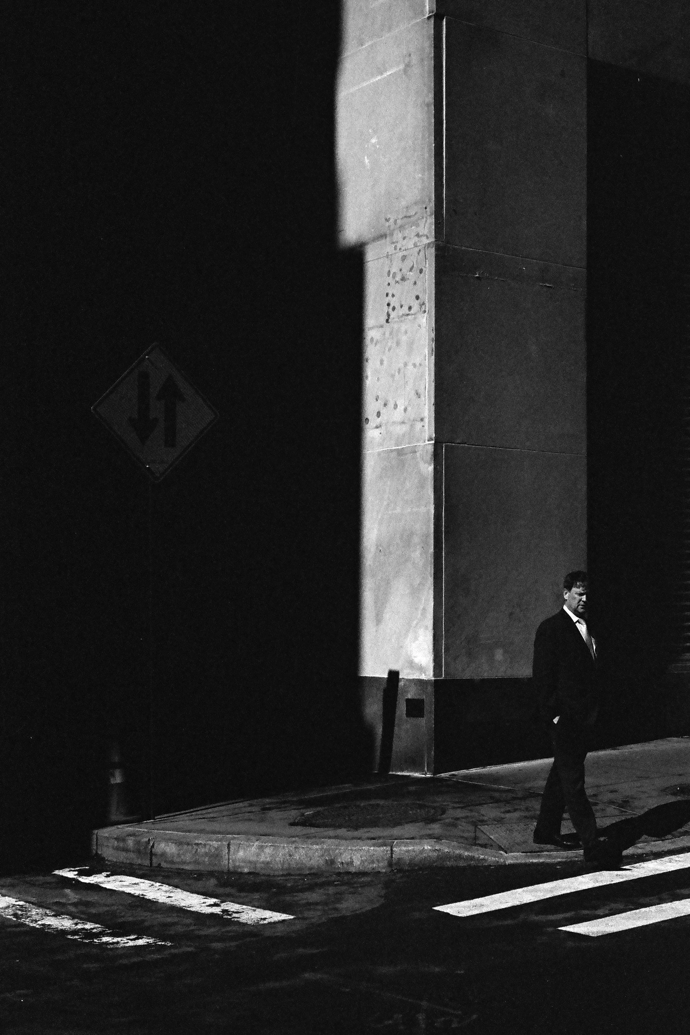 A suited man without an overcoat, some corner in the district, I forget which.