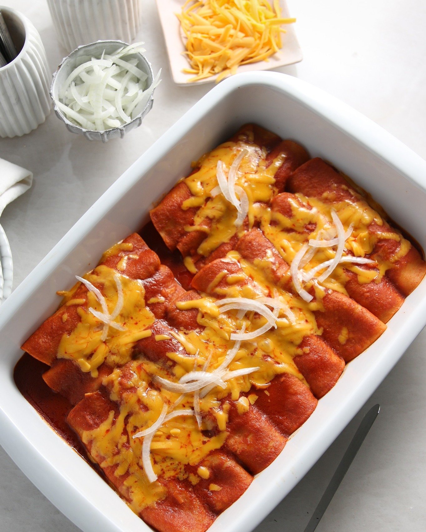 This cheese enchilada recipe is a family favorite and so satisfying. It's an easy to adapt recipe by adding ground meat or shredded chicken. My recipe is at yvettezunigajemison.com and if you have my cookbook, My South Texas Kitchen, it's on page 48.