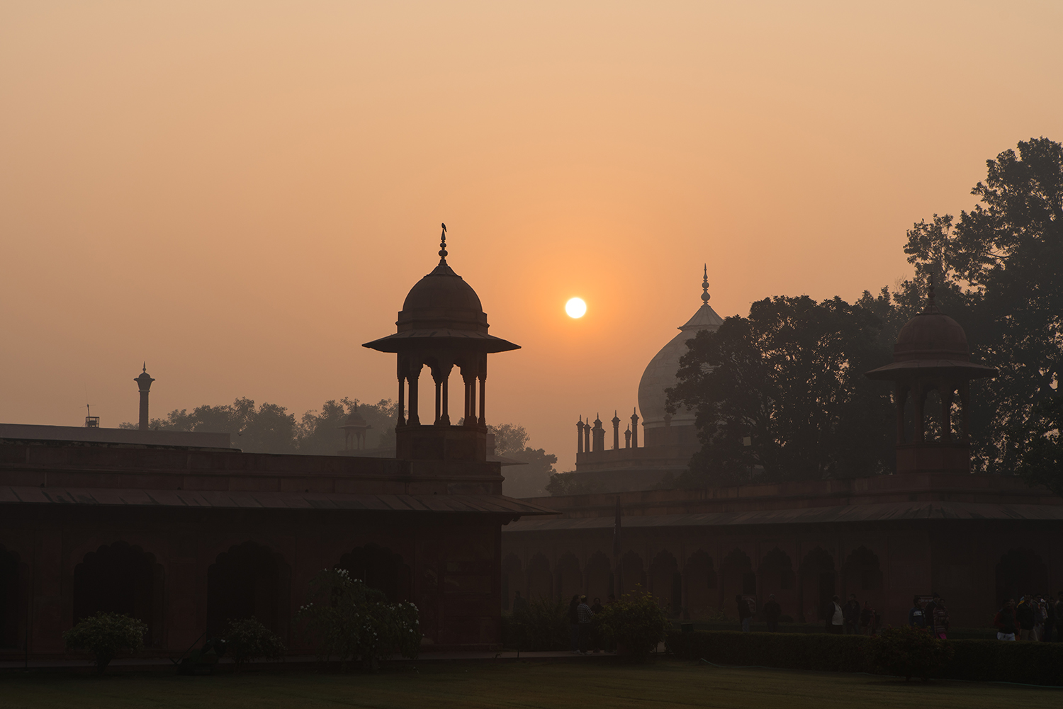 The sun rising over the Taj Mahal