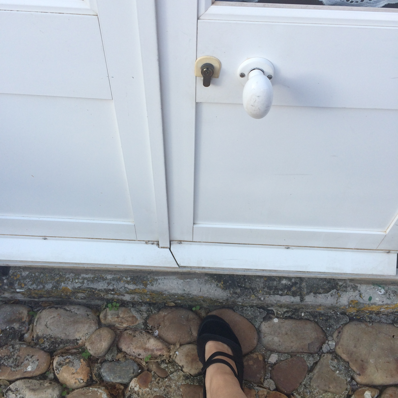 I had to chuckle because the door knob to my room only came up to my knee. I'm short and even I found locking and unlocking my door awkward. 