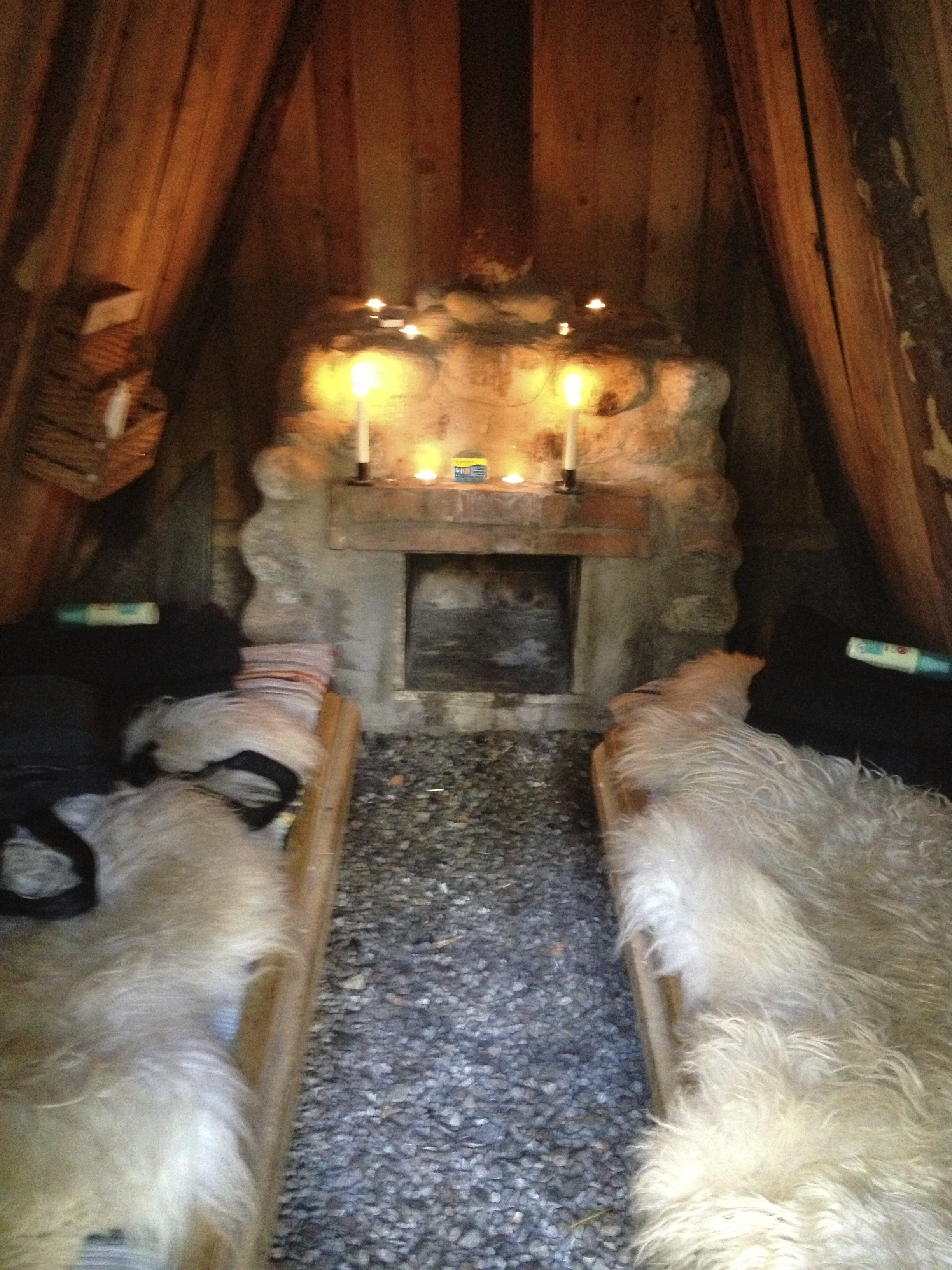 The inside of my hut complete with wood burning stove and wooden planks with sheepskin to sleep on. We also added some padding and a sleeping bag for good measure. 