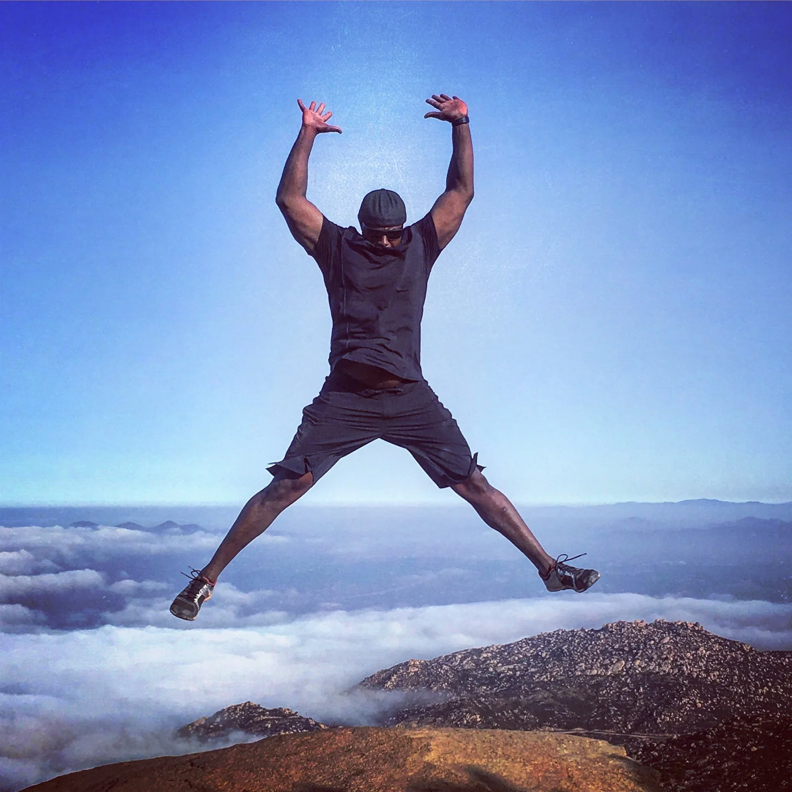 Coach Milo high above the clouds at Potato Chip Rock.
