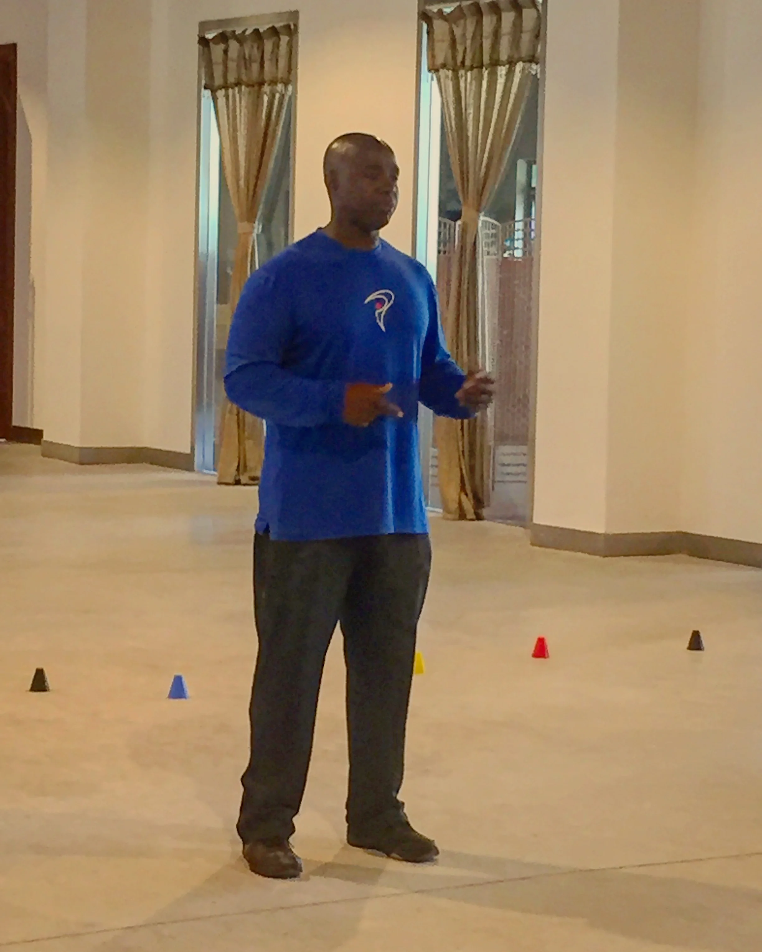 Coach Milo teaching golf professionals at a seminar in China.