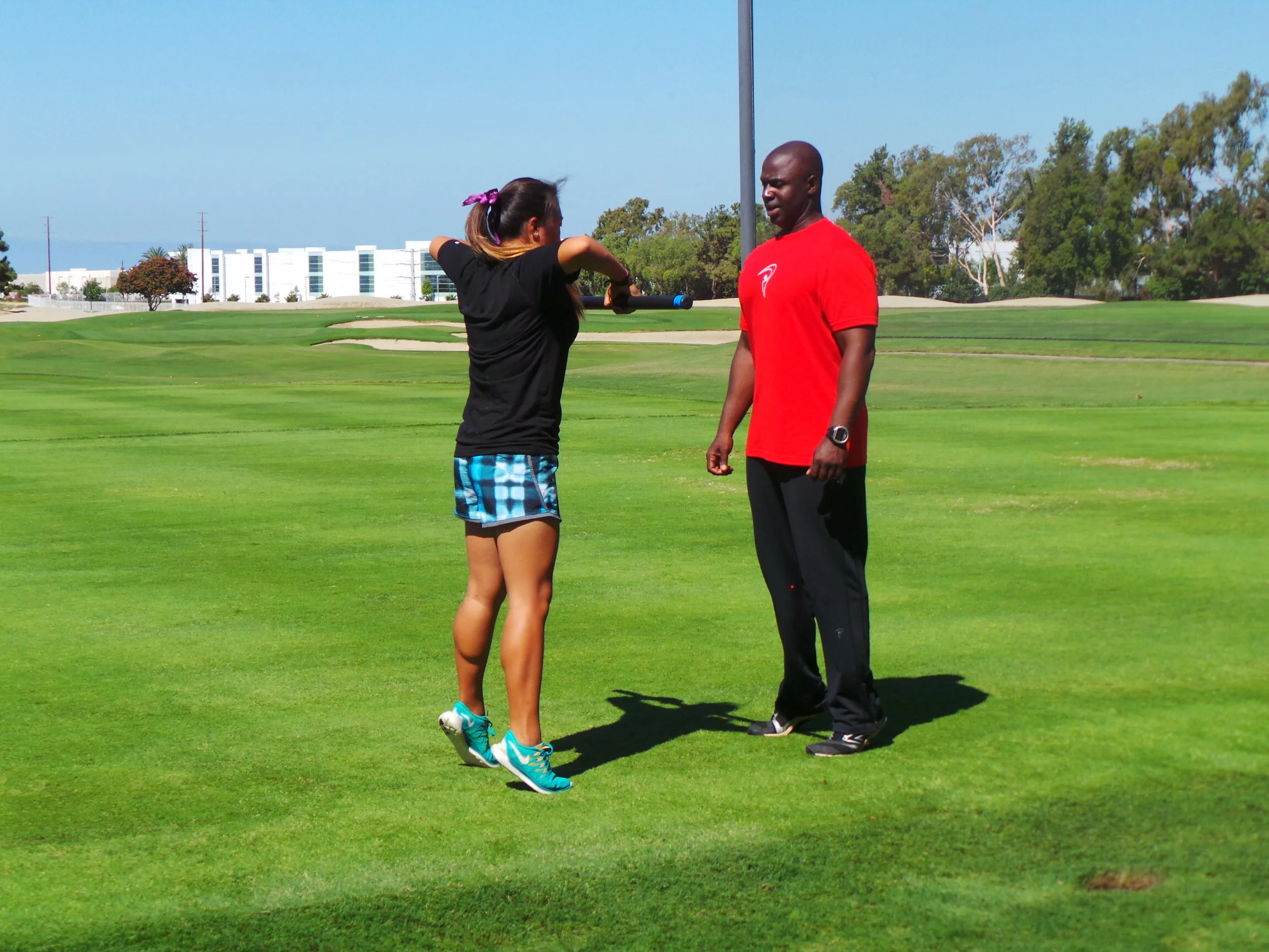 Coach Milo and a young athlete during a video shoot at the Titleist Performance Institute.
