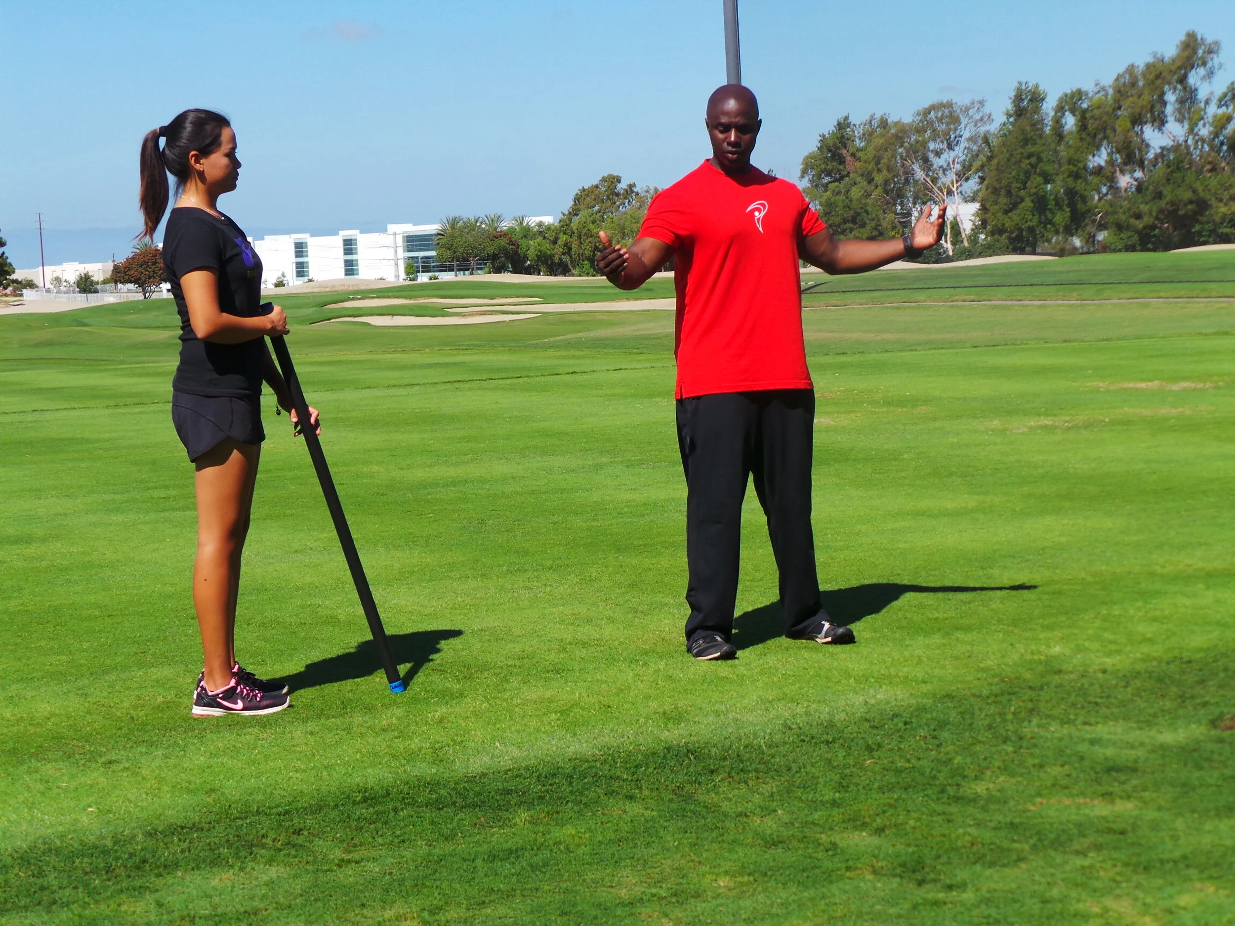 Coach Milo and a young athlete during a video shoot at the Titleist Performance Institute.