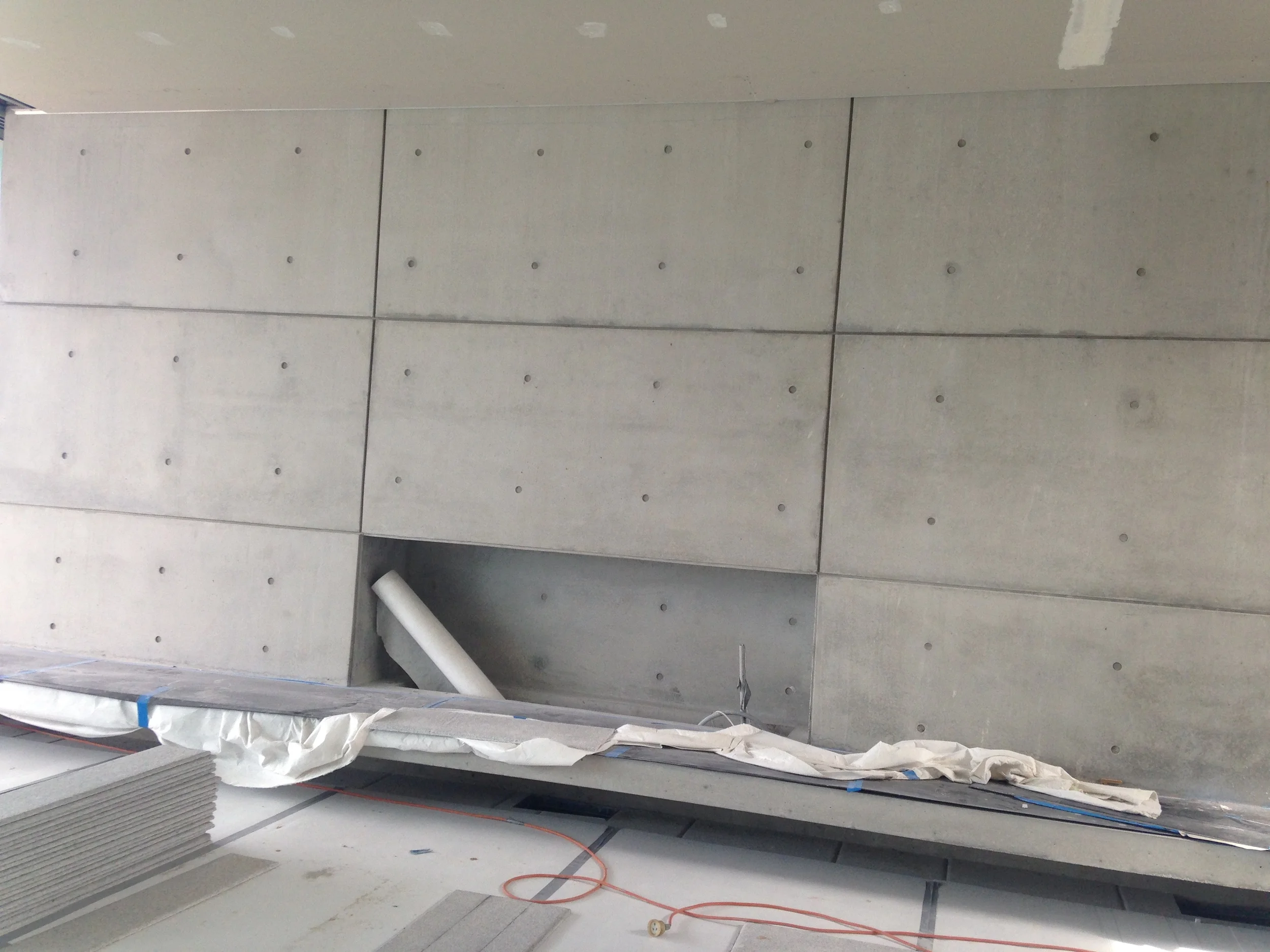 The off-form bare concrete creates a stunning feature wall.