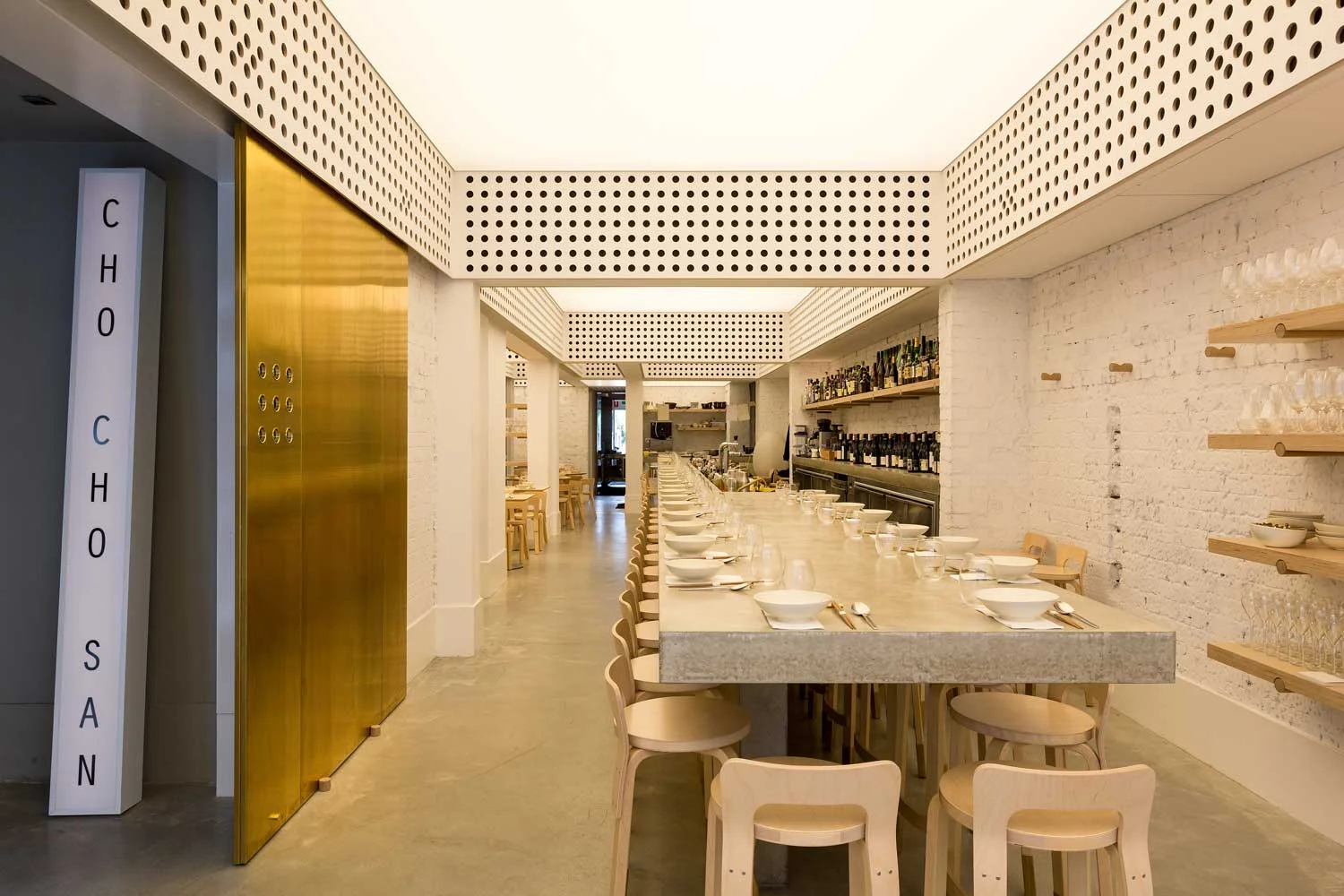 We love the interior of Cho Cho San by George Livissianis with its back-lit ceiling that provides warm and ambient light for daytime and evening dining. The stretched Barrisol ceiling is a unique design feature that creates subtle lighting in what was a cavernous space with little access to natural light. 
