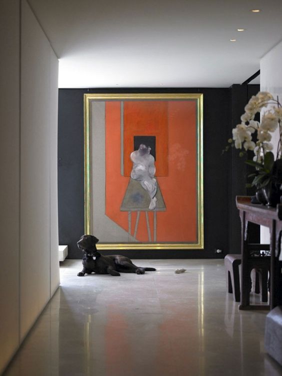 The burnt orange in the artwork is the perfect accent to the indigo walls of Donna Karan’s Manhattan apartment.