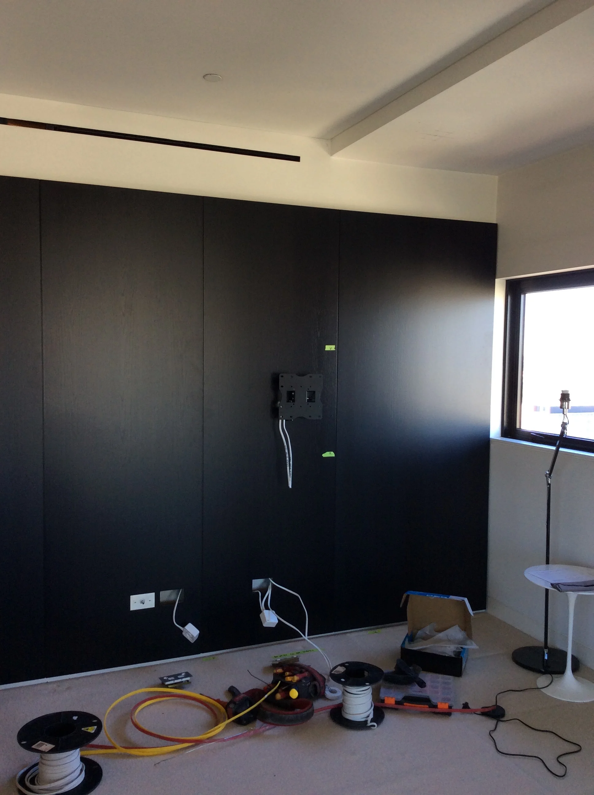 We added a new television wall bracket for better accessibility and a more contemporary look to complement the reinstalled French polished wall panels