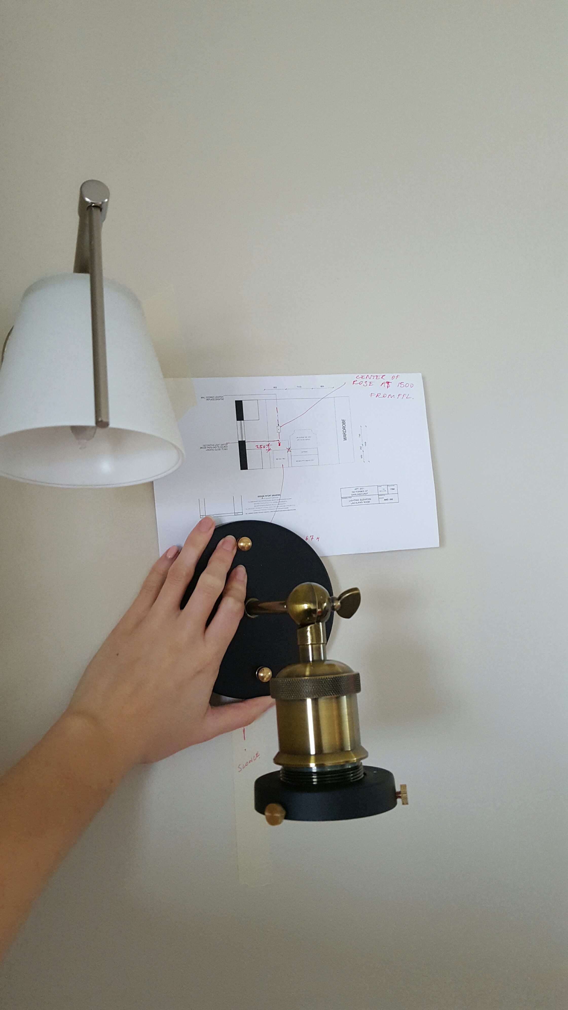 Let there be light! Mapping out the location of the new wall sconce.