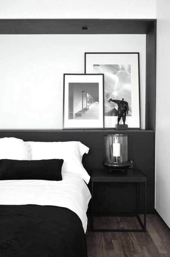 This bed head acts as an easel anchoring a collection of carefully curated artwork. This layered approach, simply by leaning the pieces against a crisp white wall, creates casual perfection.