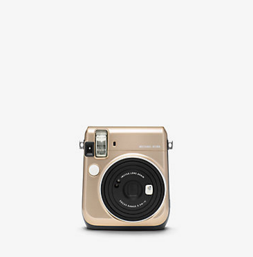 Demi is going to shake it like a polaroid picture this Christmas with the limited edition Michael Kors X FUJIFILM Insta Camera available at Michael Kors. 