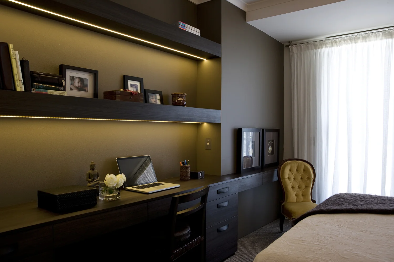 Walls adorned in chocolate tones provide warmth and serenity in our Bourke Street master bedroom. The addition of fresh white linen and sheer drapes completes the luxurious yet inviting space
