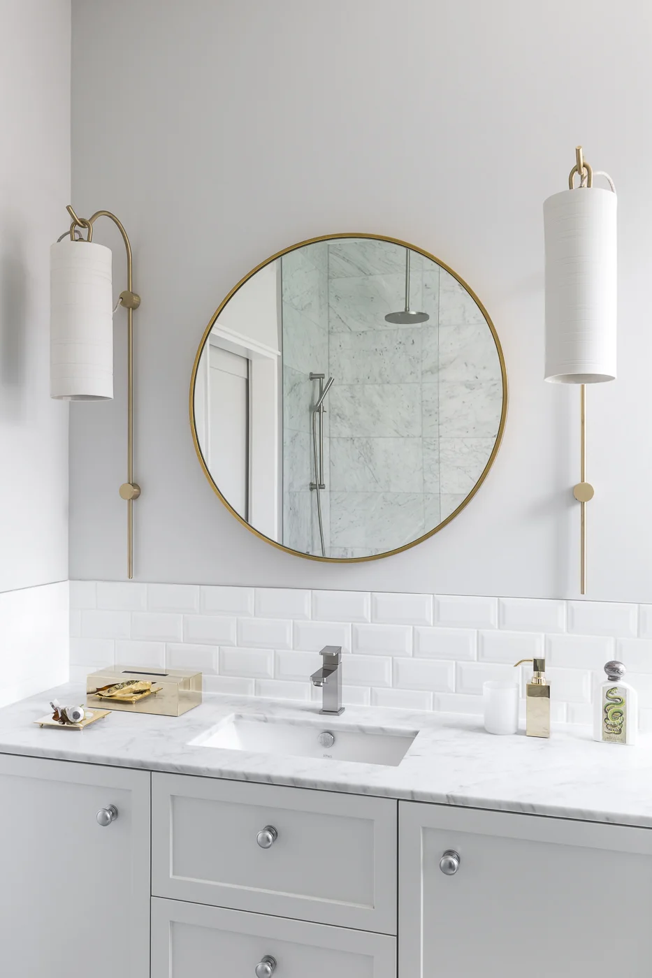 Generous wall light fittings complement a simple and yet luxurious master ensuite.