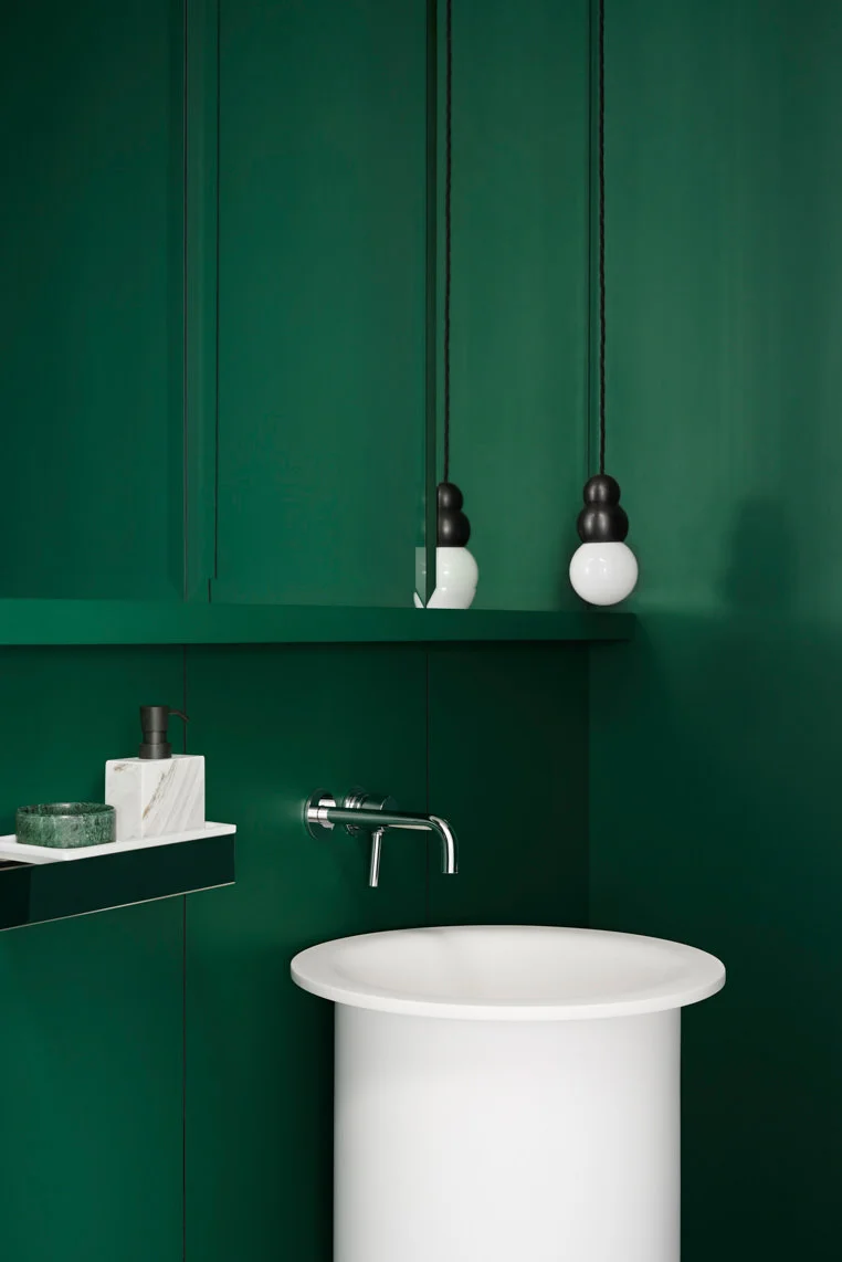 The Williamstown Residence by Fiona Lynch Design is a saturation of colour enveloping the powder room for a bold statement.