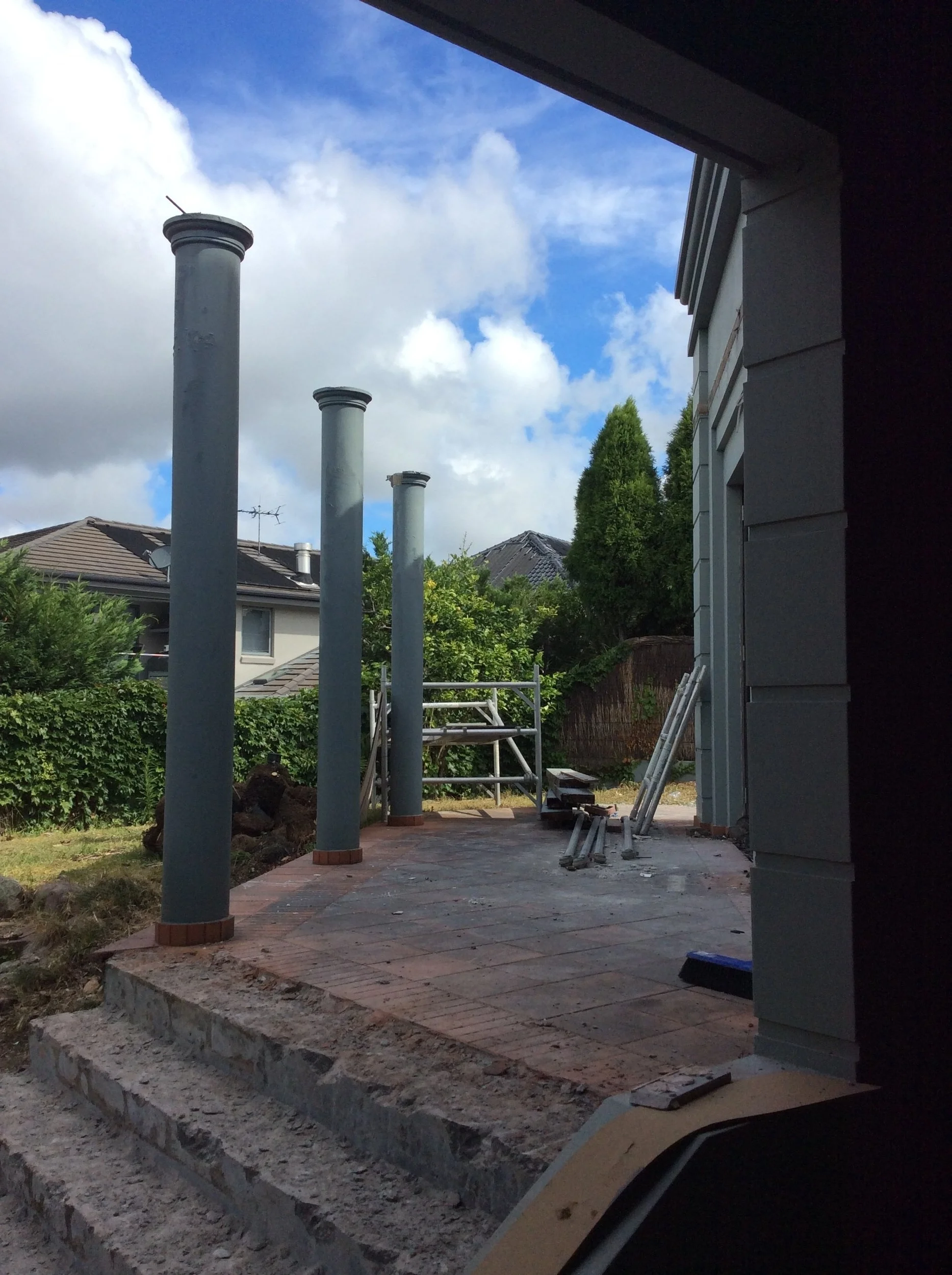 One of the many terraces receiving new tiling and stone edging. The existing round exterior columns are to be removed and replaced with a new contemporary spotted gum pergola.