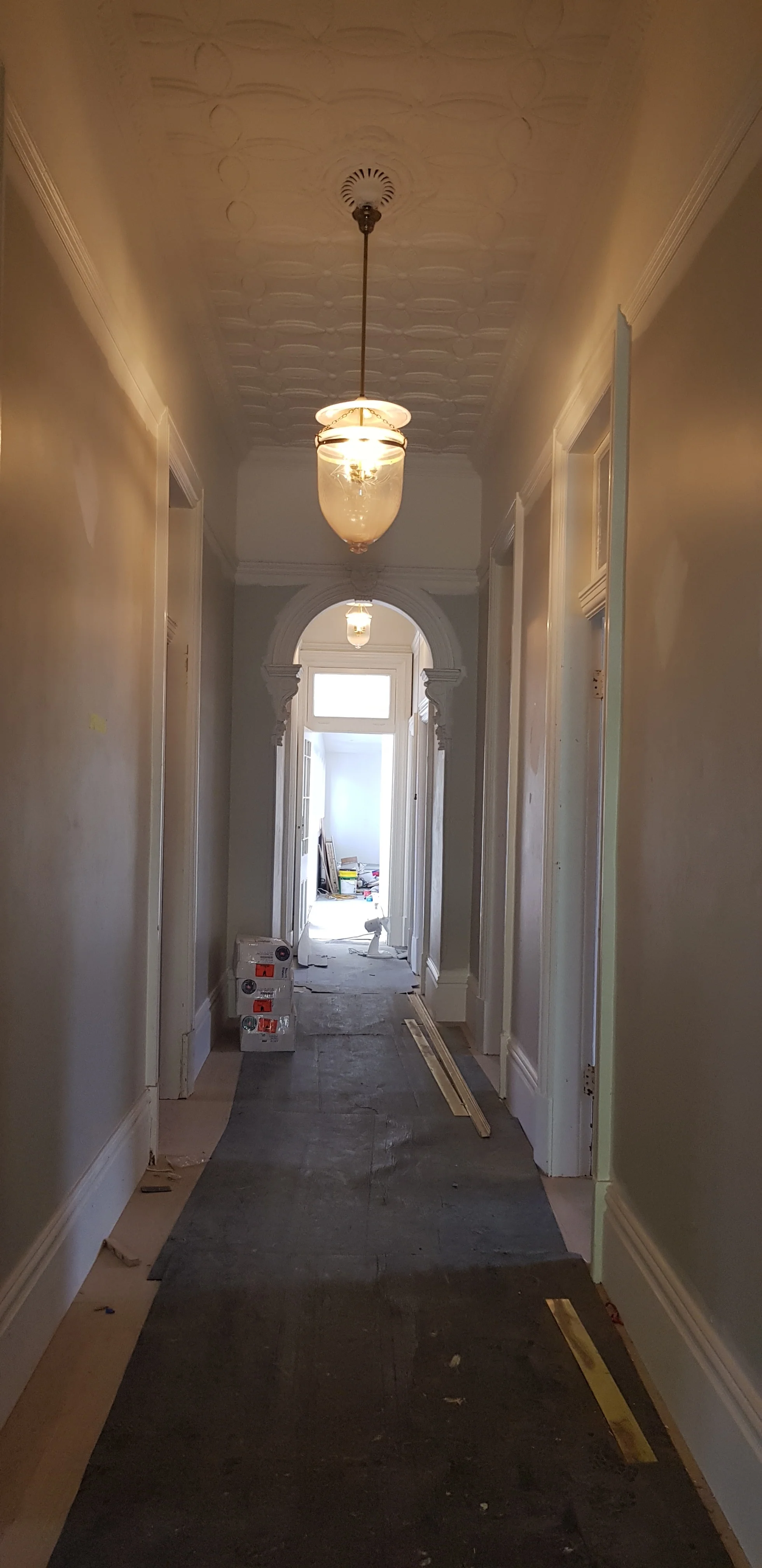 The hallway features an original horsehair plaster ceiling.