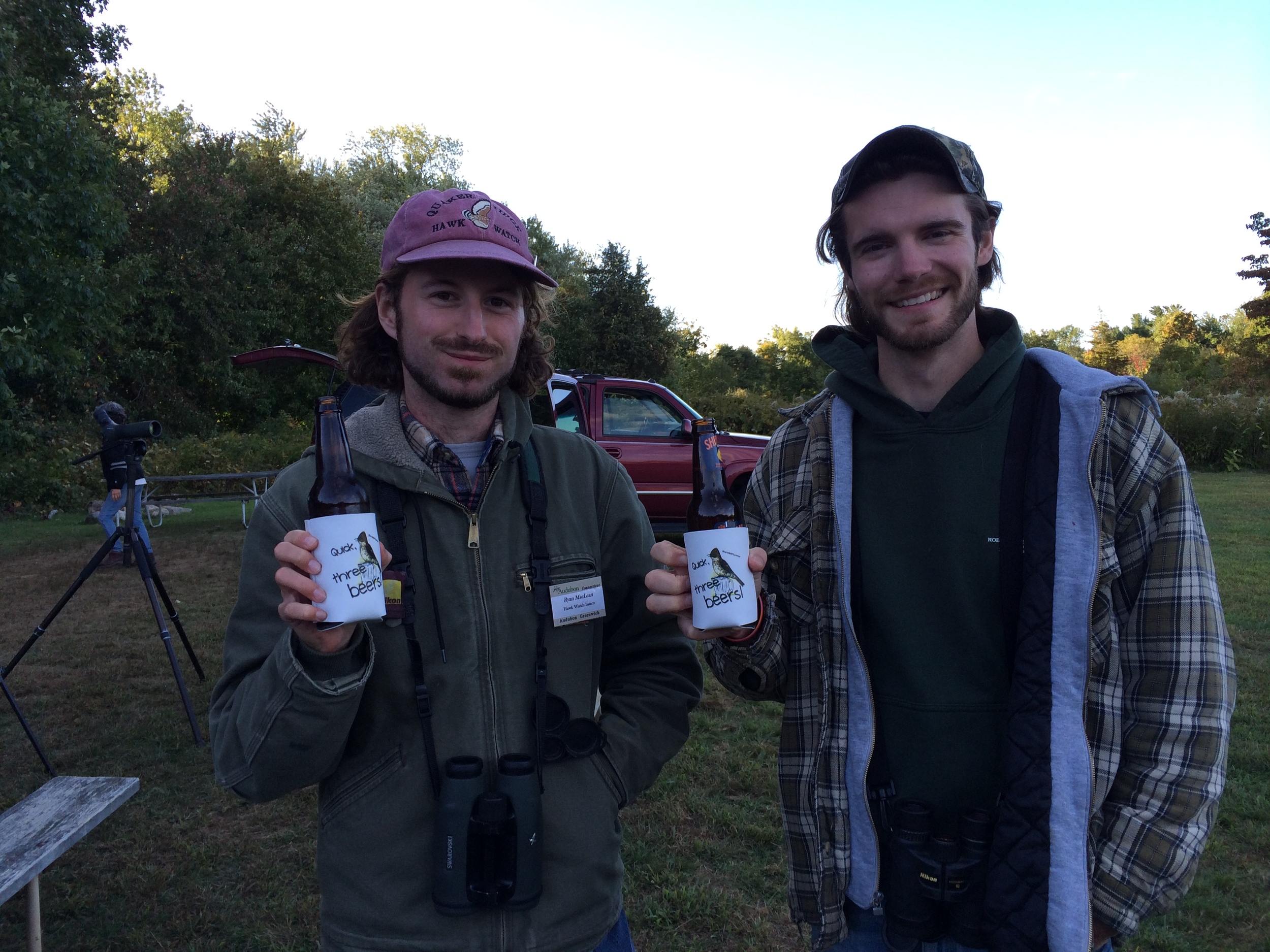 Hawk watchers Ryan and Shawn celebrate another successful day with their new "Quick, Three Beers!" beer cozies! 