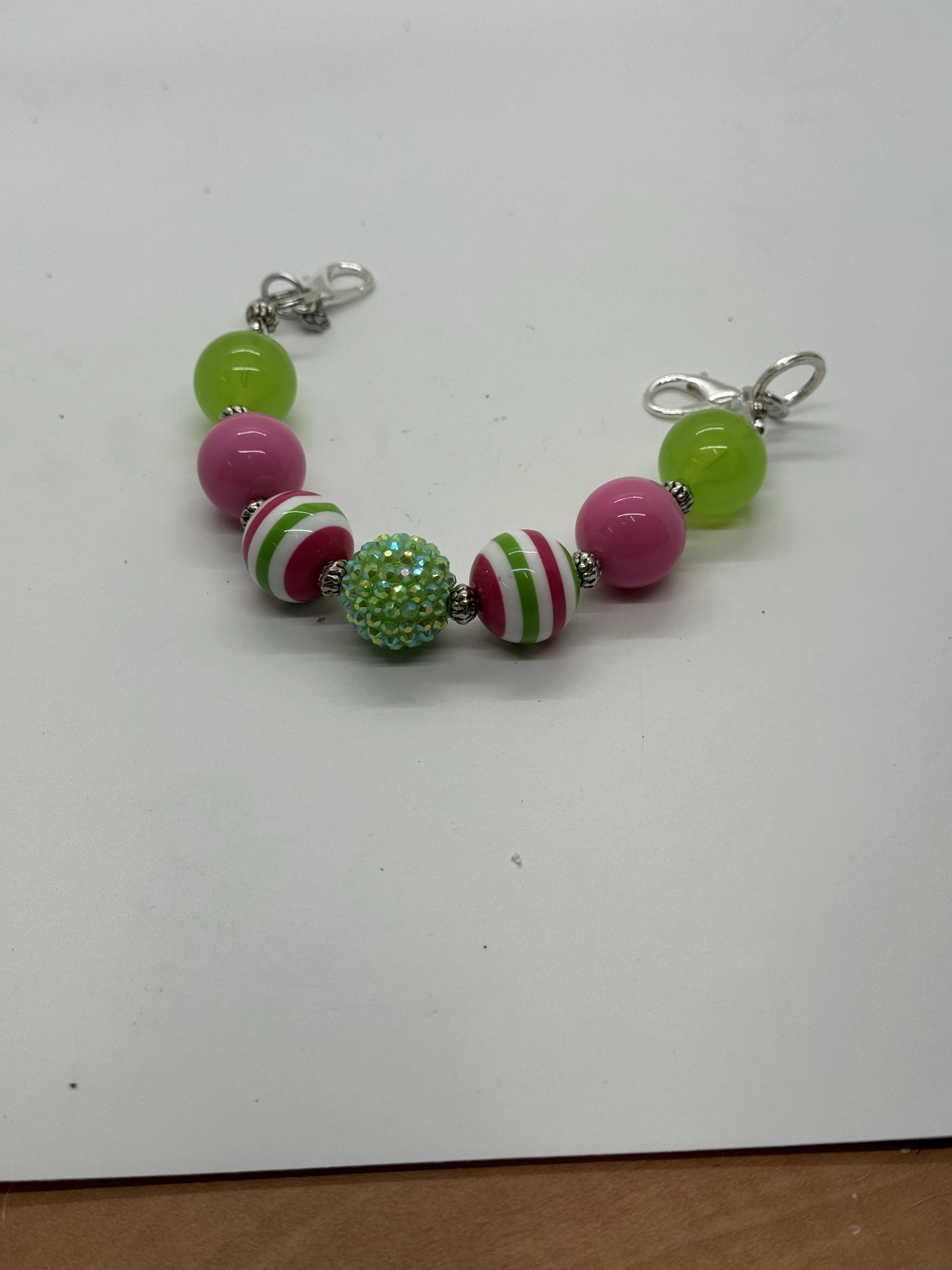 Green,Pink & striped Clutch handle.jpg