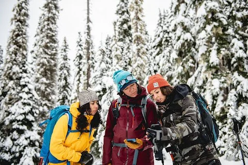 An image of Dani Reyes with two other women solo travelers during the trip with AdventurUs.