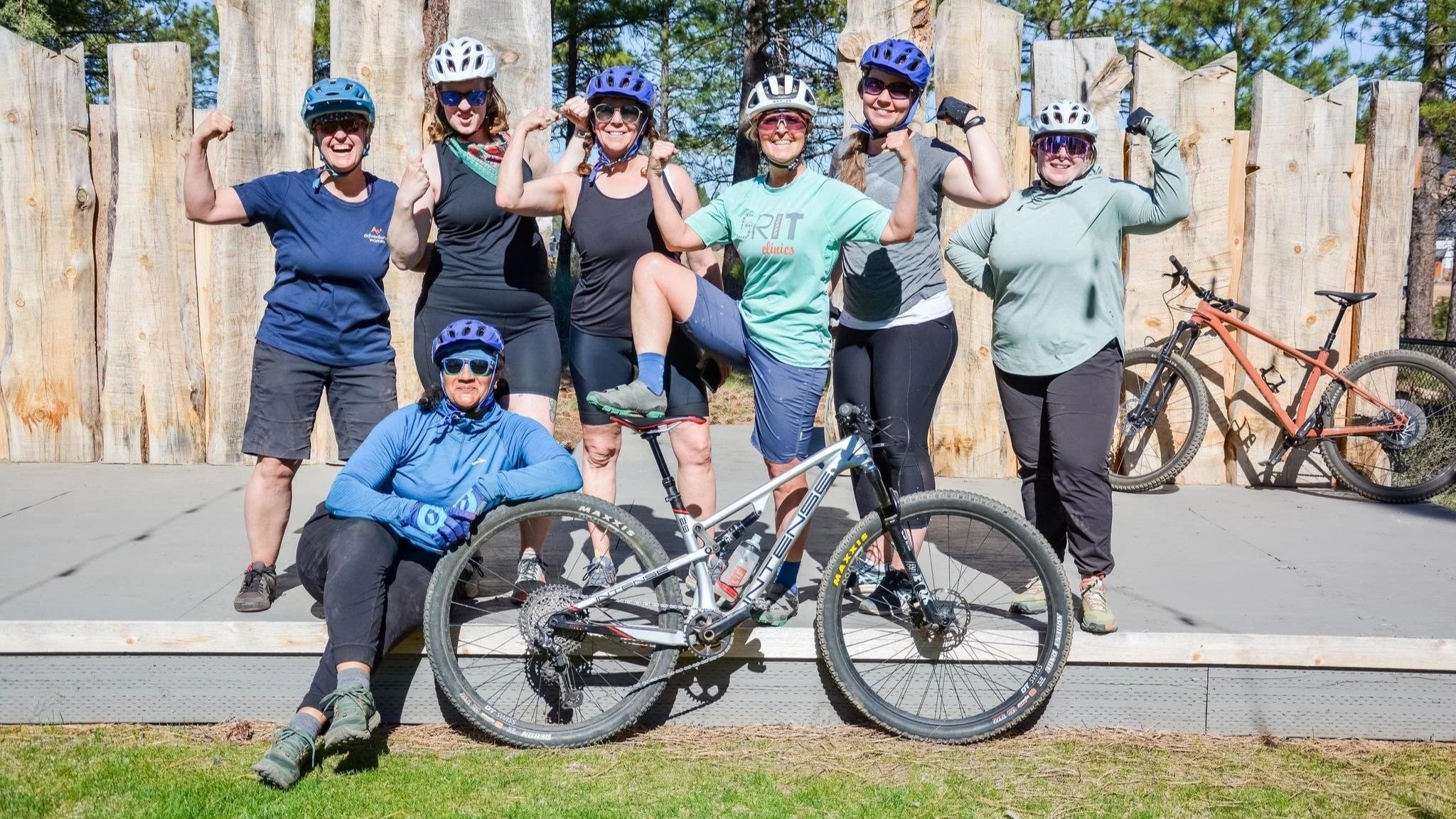 Group of women mountain bikers celebrating at Camp AdventurUs women's adventure retreat, Bend, Oregon.