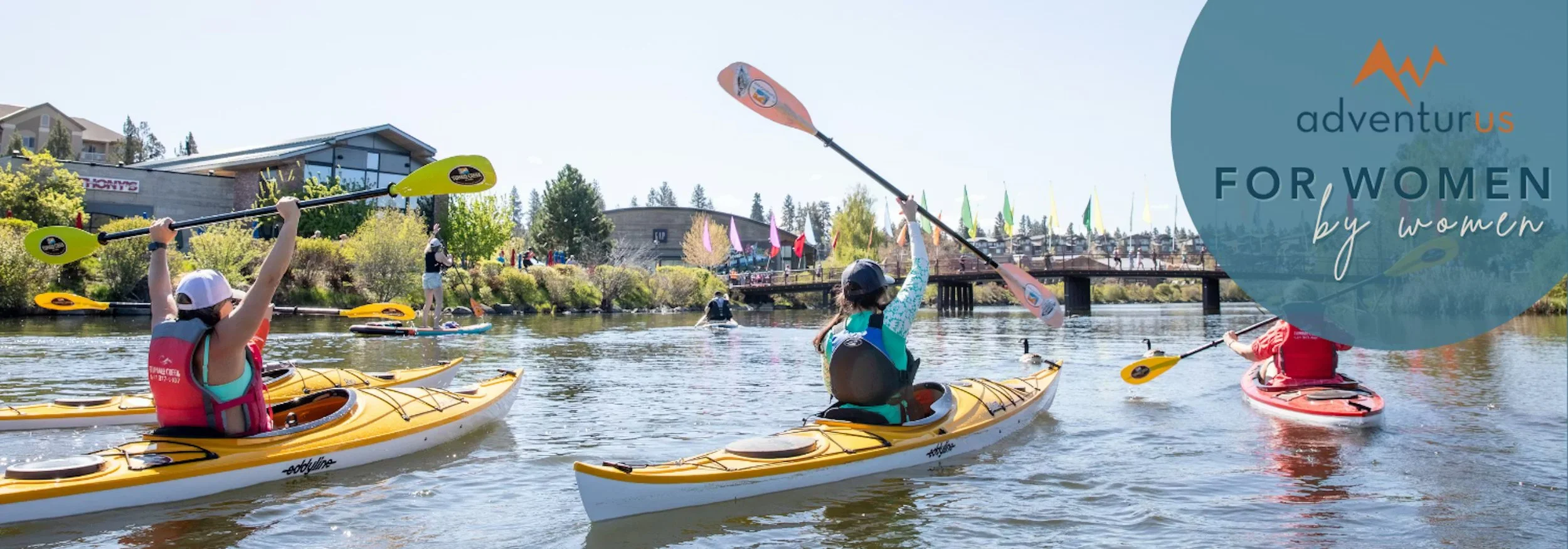 A team of kayaks in a river in Bend as part of AdventurUs camp.