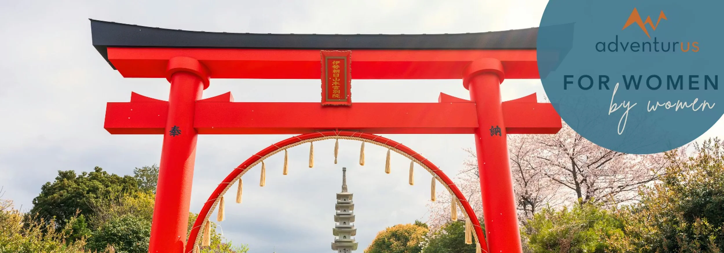 Red torii gate framing a pagoda, with cherry blossoms and a “adventurus – for women by women” logo.