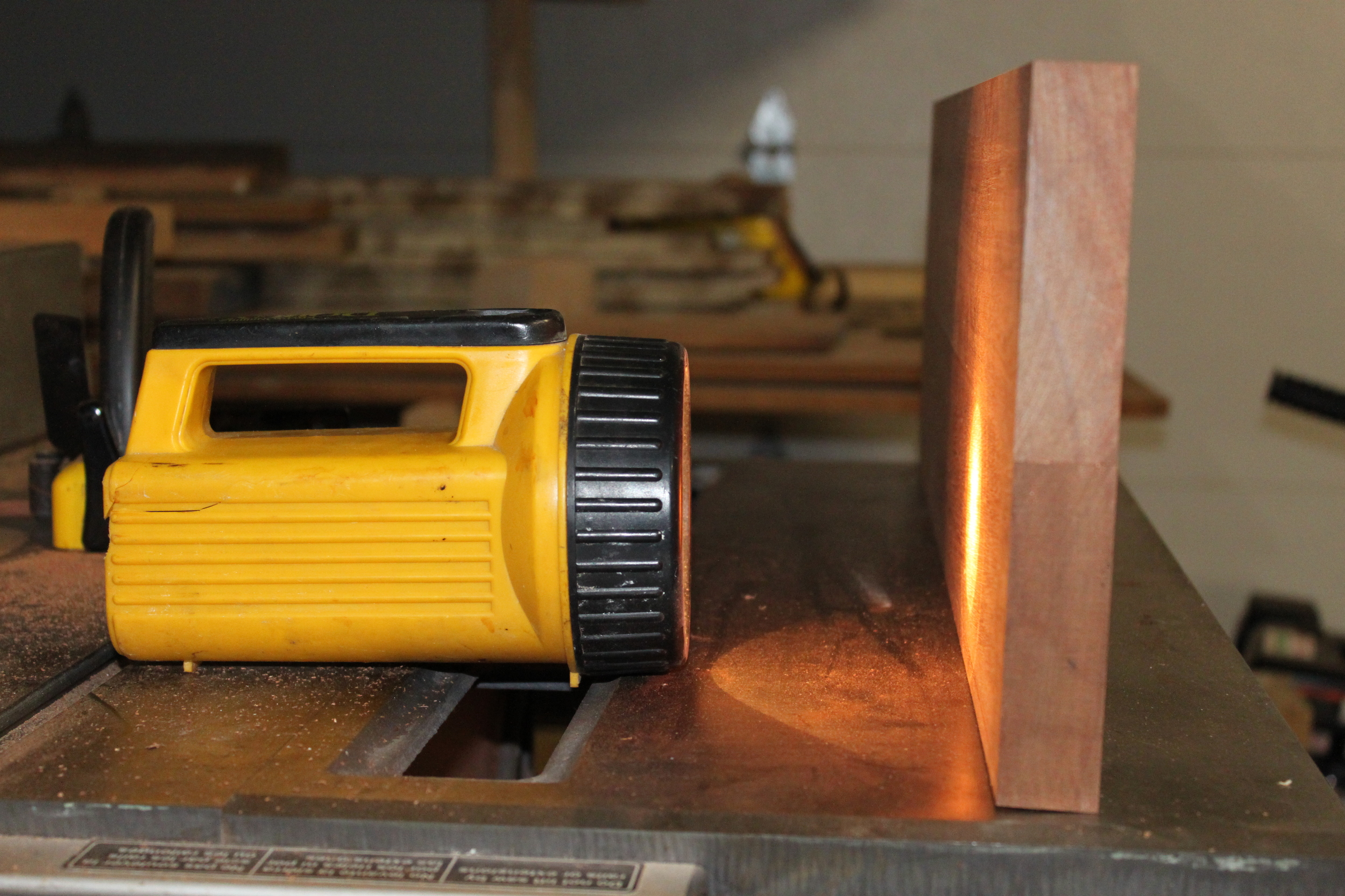 Set the two mating edges on a flat surface and put a flashlight behind them. If you can see light poking through the other side, you're off. 