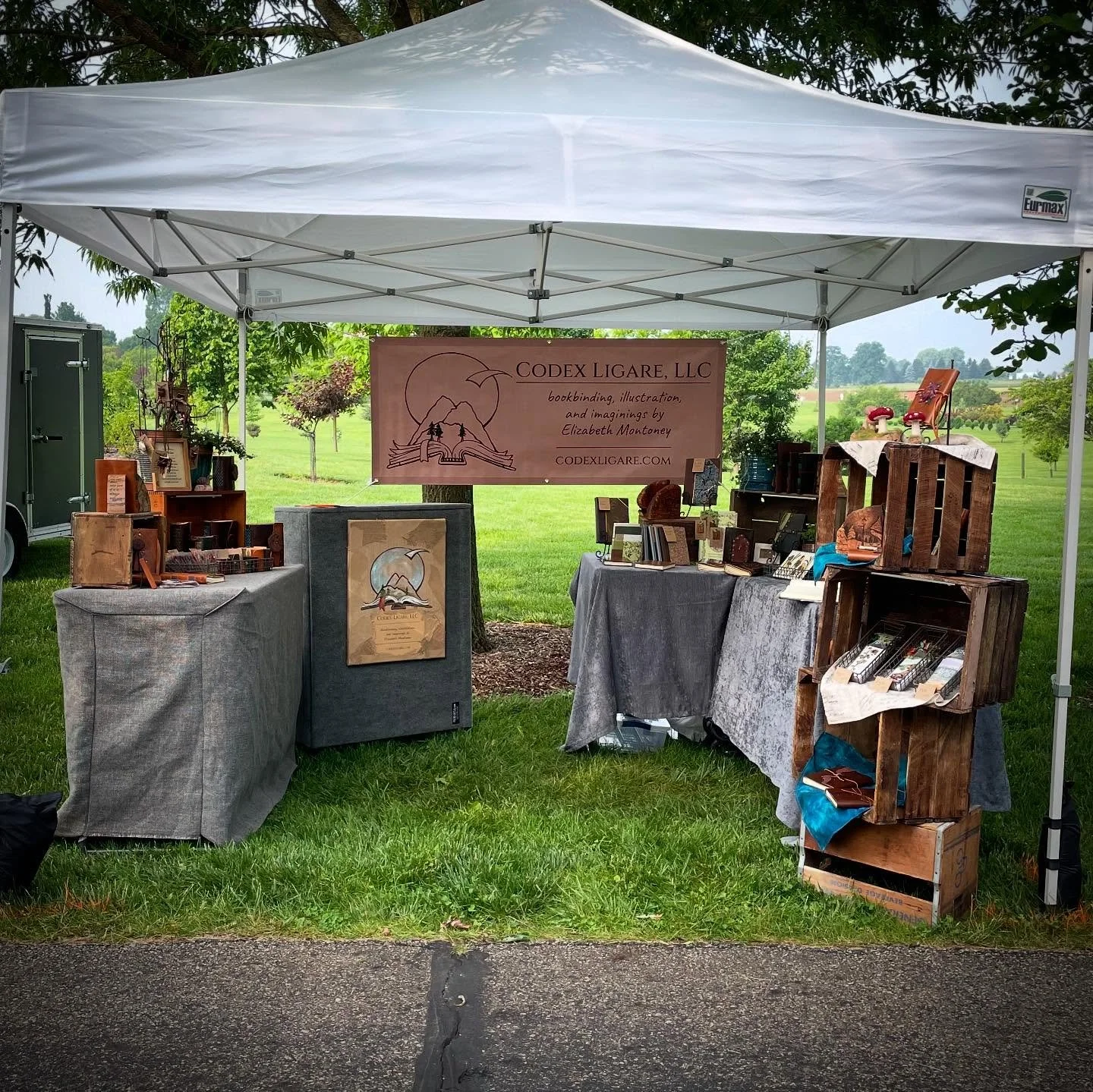 All set up at the Secrest Garden Fair! The perfect place to debut my Secret Garden limited series of journals and bookmarks! They have a magnetic clasp, moss green leather, lattice stitching, garden door and key embellishment, and open to reveal gard