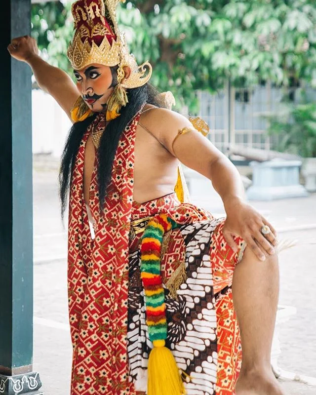 A profoundly ornate male Javanese Kraton dancer warming up before his performance. Javanese dance is a memorizing, controlled and exquisitely graceful art form. Its history stems back hundreds of years and was fostered as a court dance for the origin
