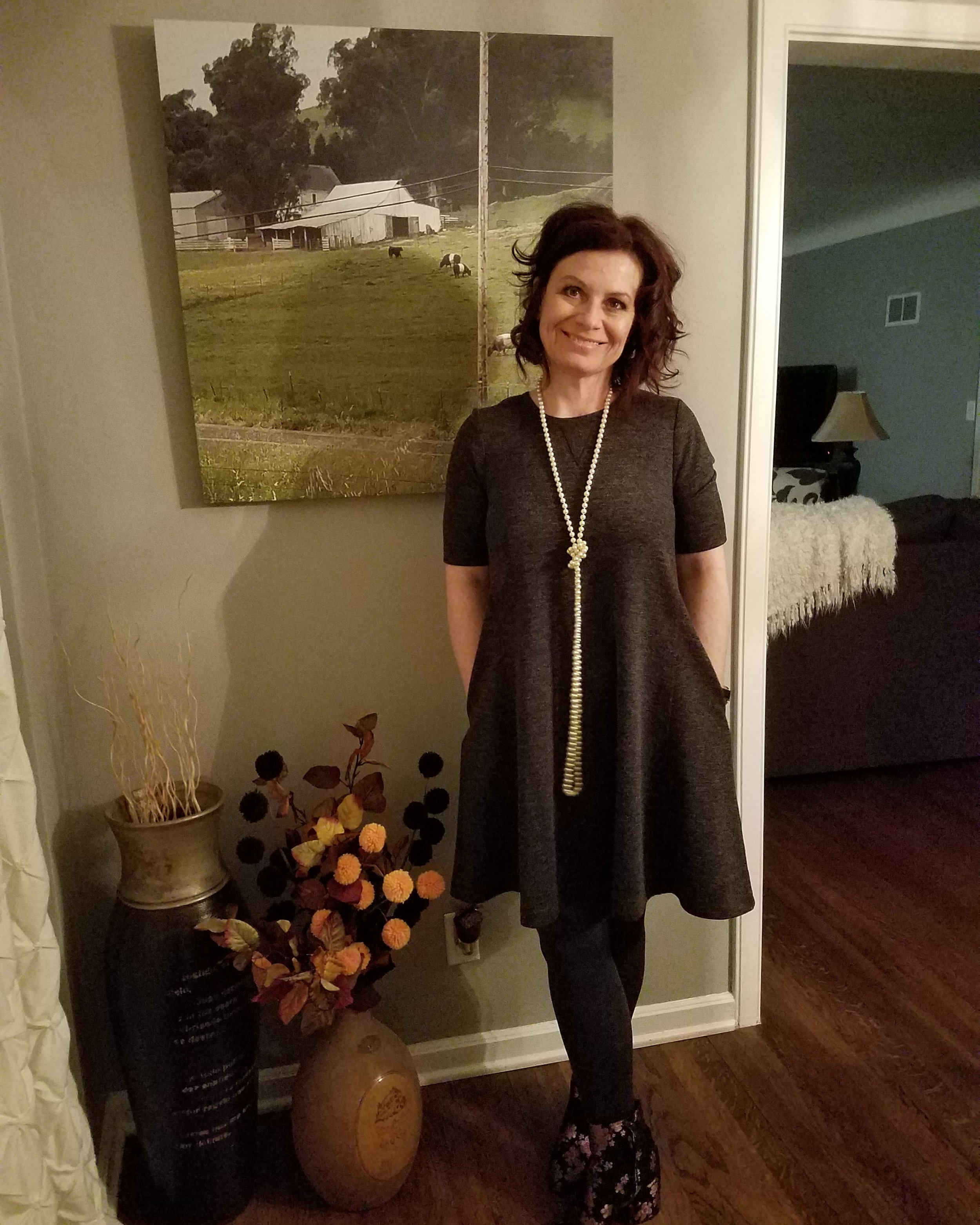 Here's the gray dress again. This time dressed differently to celebrate my favorite film student's birthday. Paired with tights and floral booties - love this! A simple dress in a neutral color can really be worn so many different ways. 