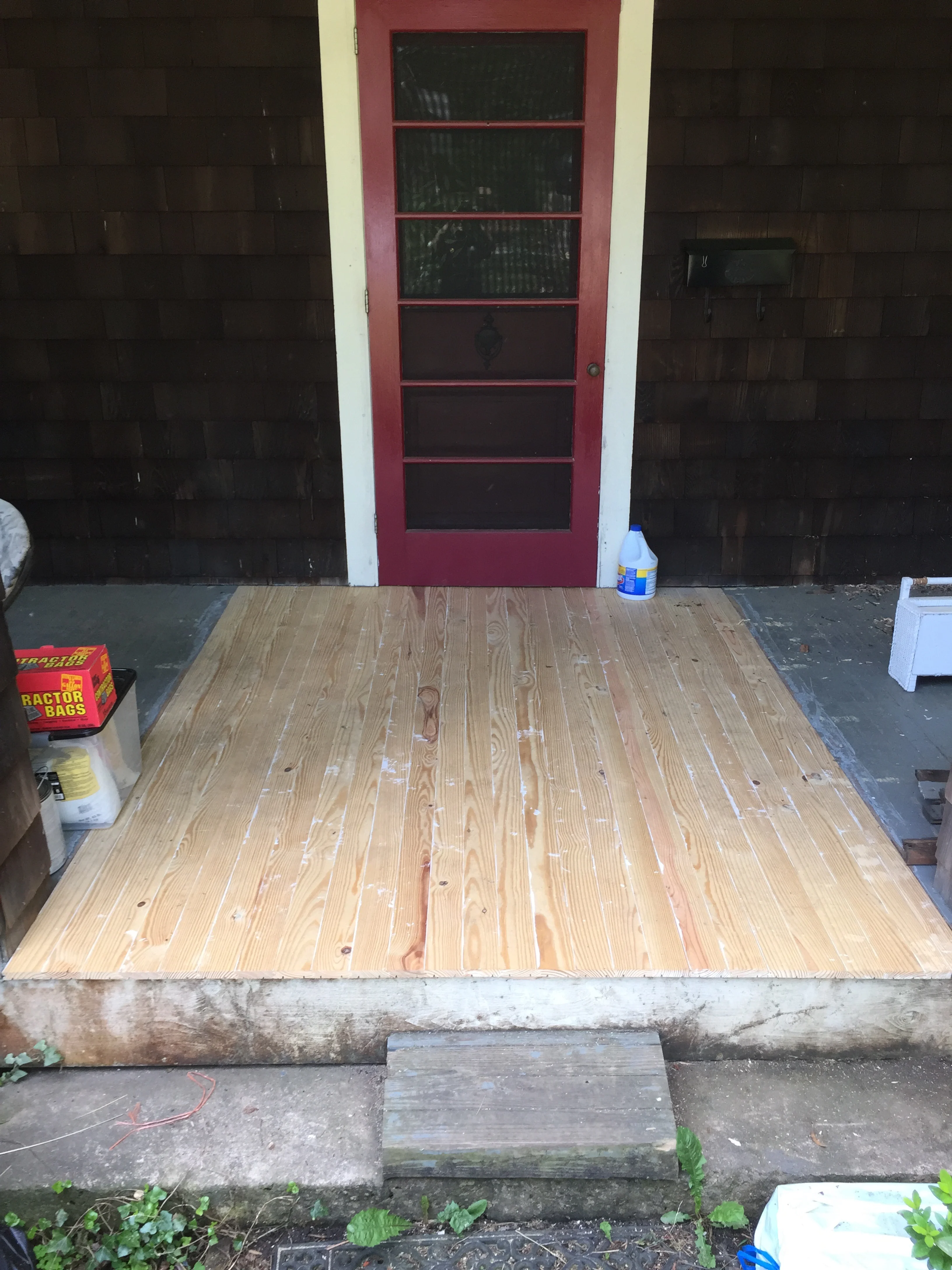 The white at the seams is from priming the bottoms of the planks before laying, to seal and protect the new floor. The floor was painted to match existing. 