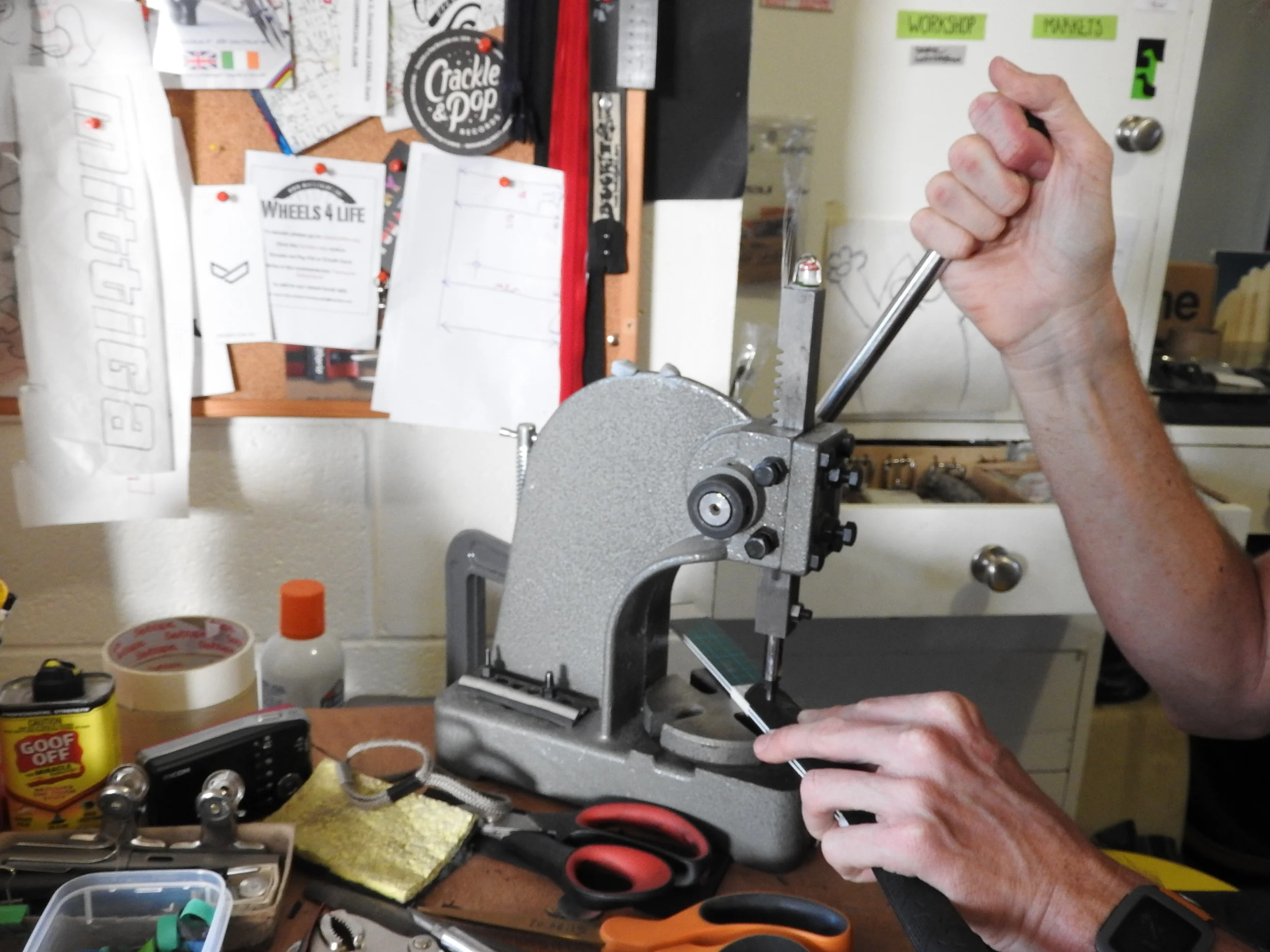 Scissors and a metal punch are the only mechanical help Craig uses.