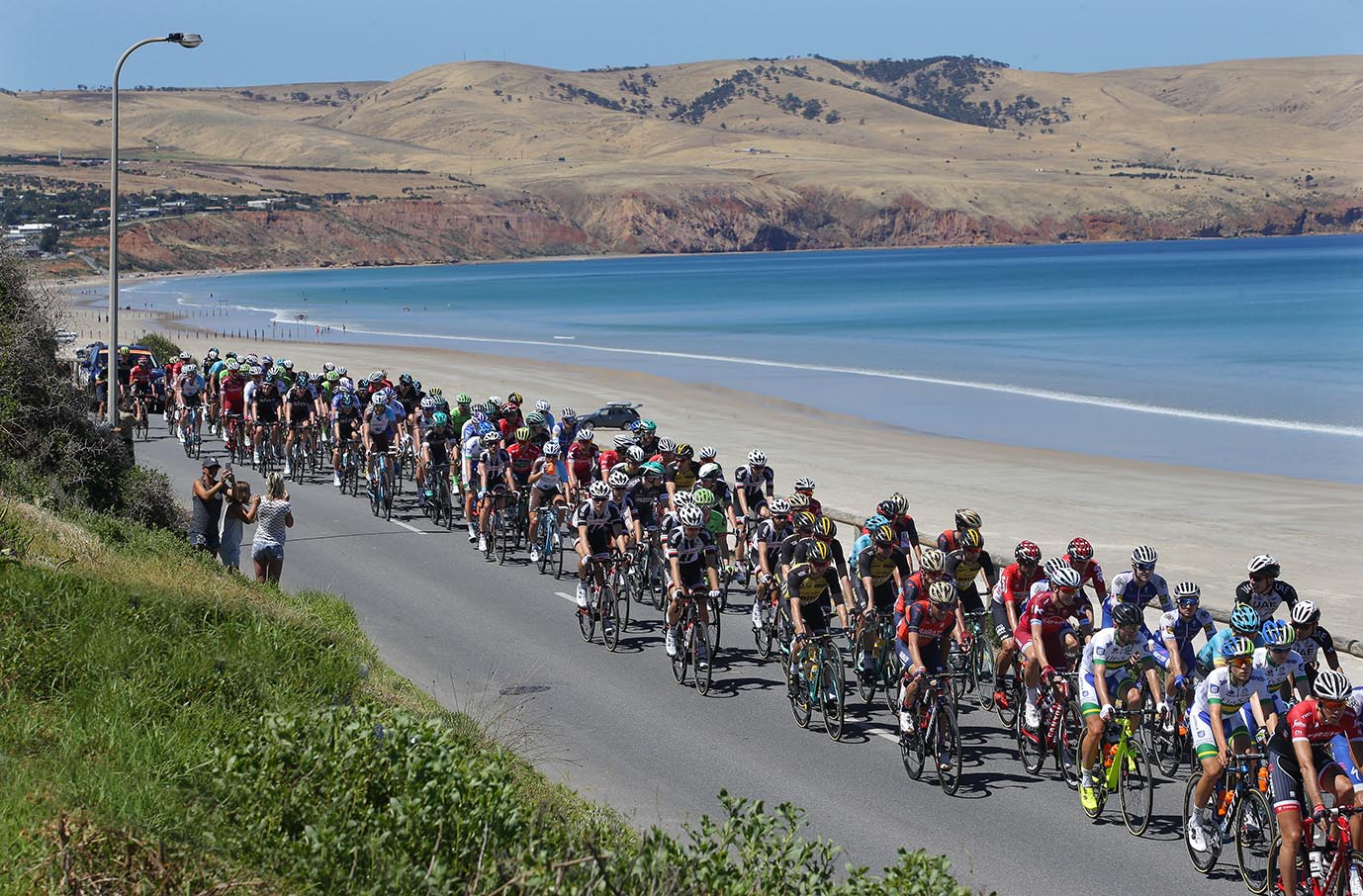 The peloton passes along the esplanade at Aldinga beach