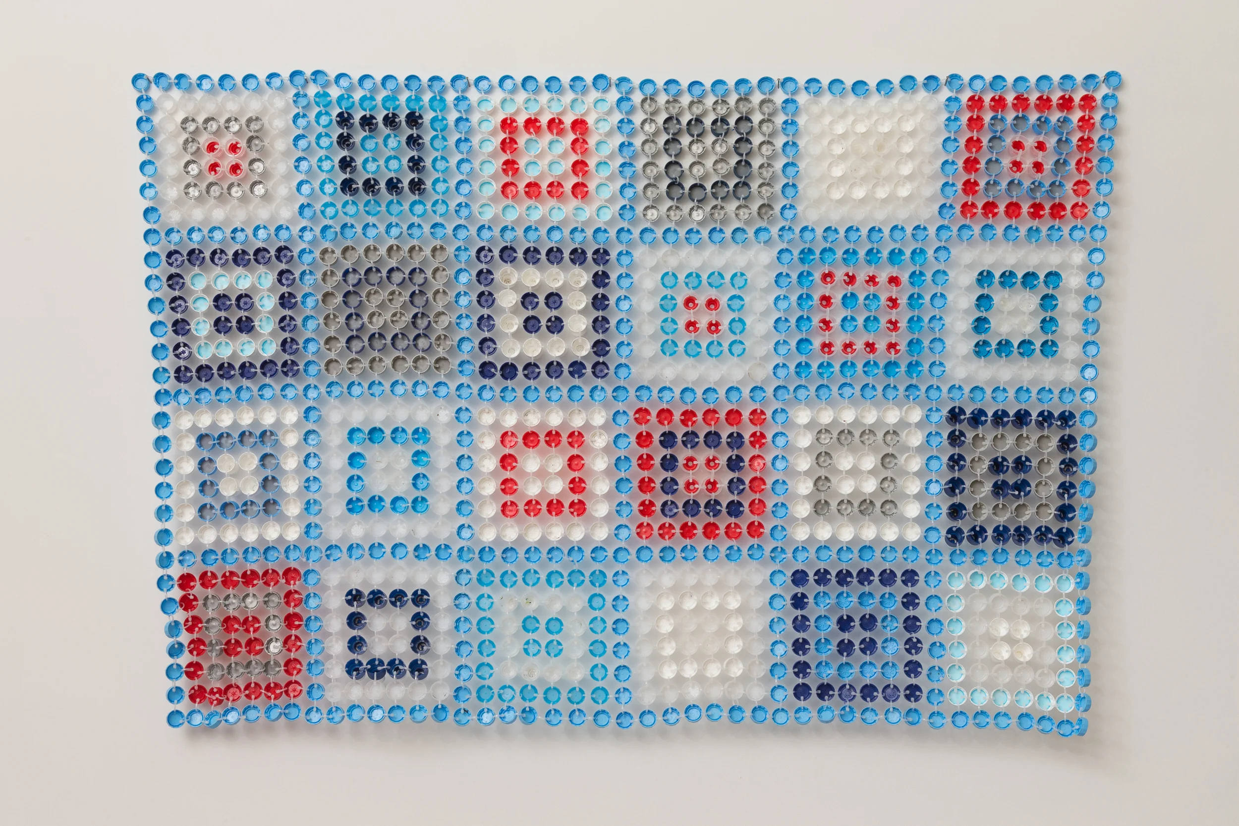 Aunty Jinnie 2014 Plastic bottle caps & cable ties 110 x 160 x 1cm photographer James Field, courtesy of Adelaide Central School of Art