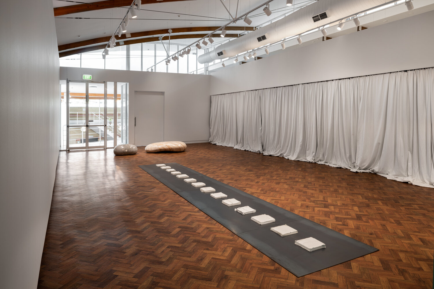  ‘The Track’ (2020). Calcium Oxide (Quicklime) tiles, stainless steel 10 x 720 x 120cm. Photo: Mark Pokorny.   