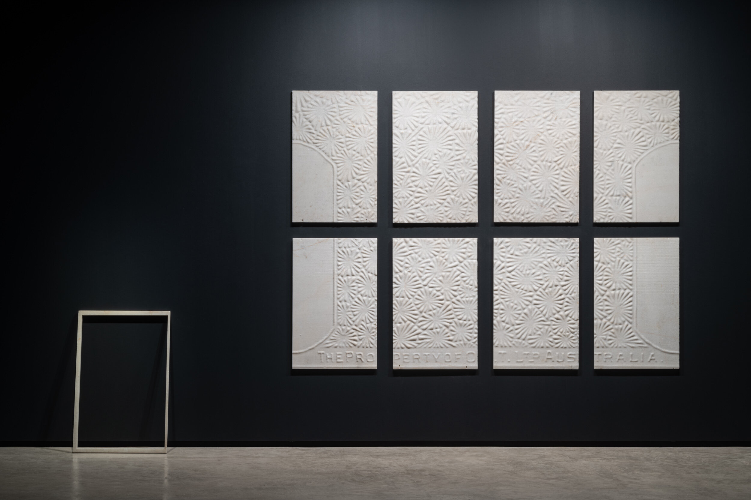  L-R: The Unremembered, 2020. Wombeyan Marble panel of the old Commonwealth Bank, George St, Sydney, 91 x 59 x 2.5cm.   History is Buried In My Backyard, 2020. Wombeyan marble, 180 x 250cm (8 panels at 85x 55cm each).   