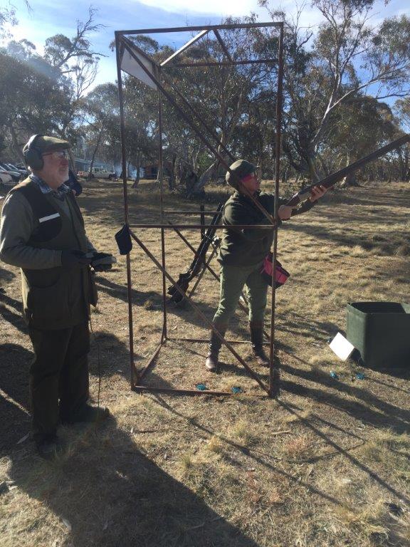 Robin Perkins takes aim with Steve MvIntyre refering.jpg