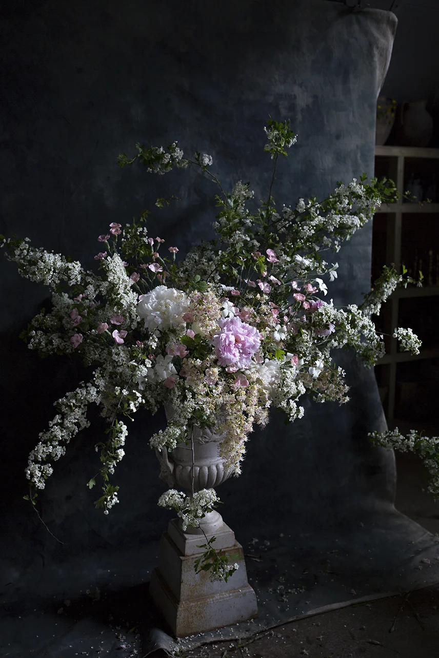 A foaming urn of hawthorn and horse chestnut branches for structure.