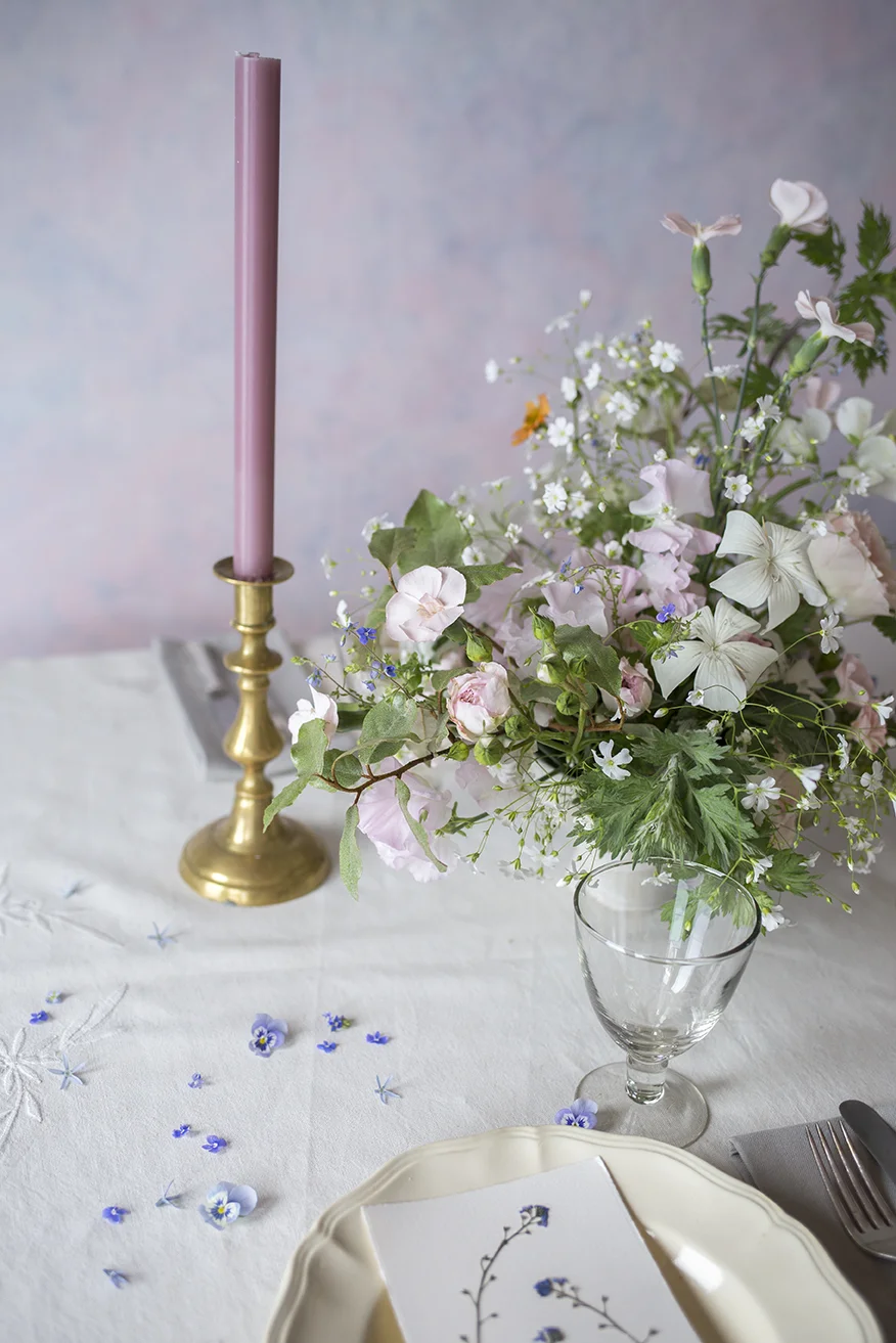 A spring garden in a bowl, with pressed forget-me-not on recycled paper place cards made by Jess.