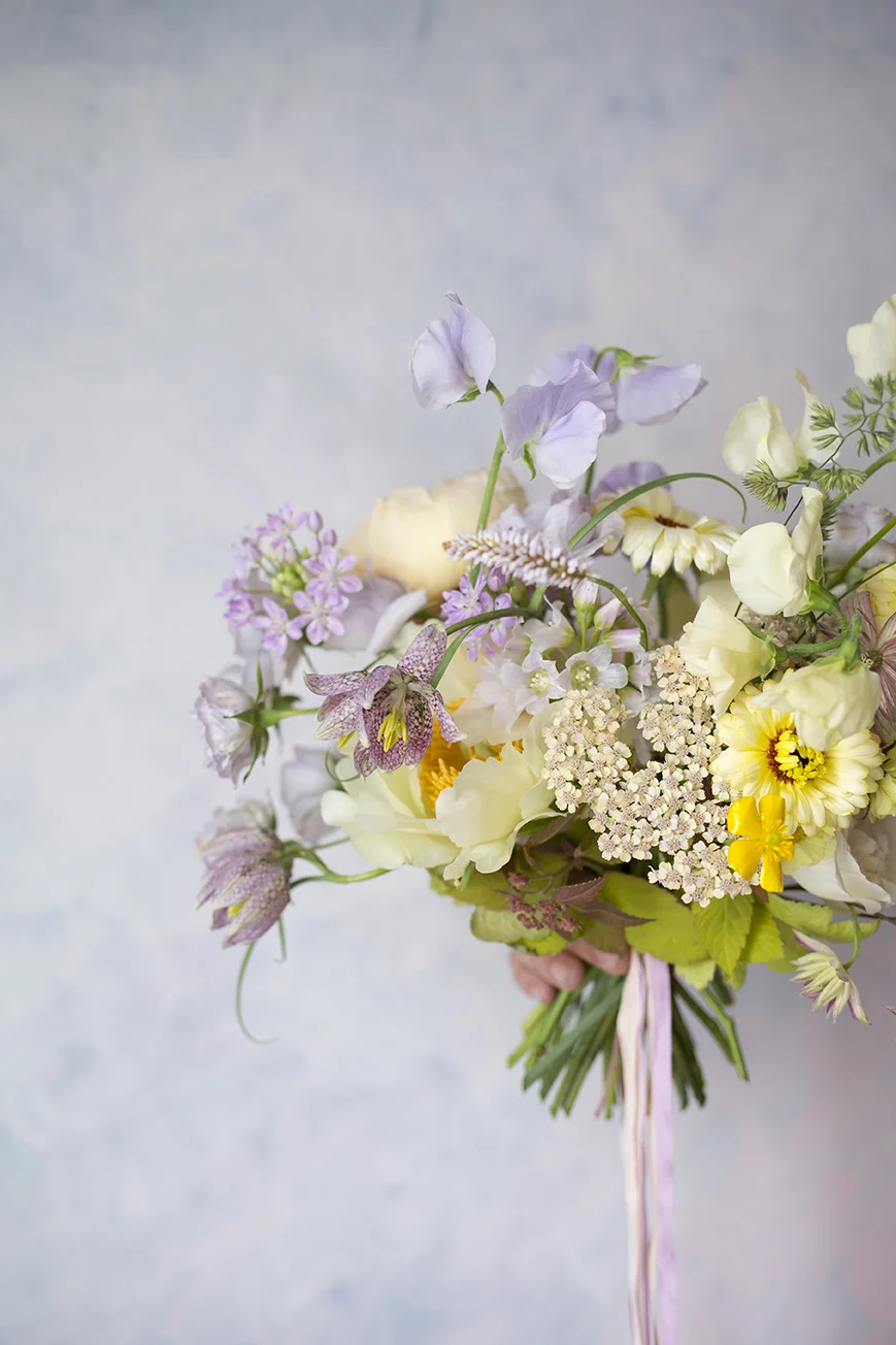 A spring wedding bouquet with fritillaria made by a student at a private class at Aesme Flower Studio
