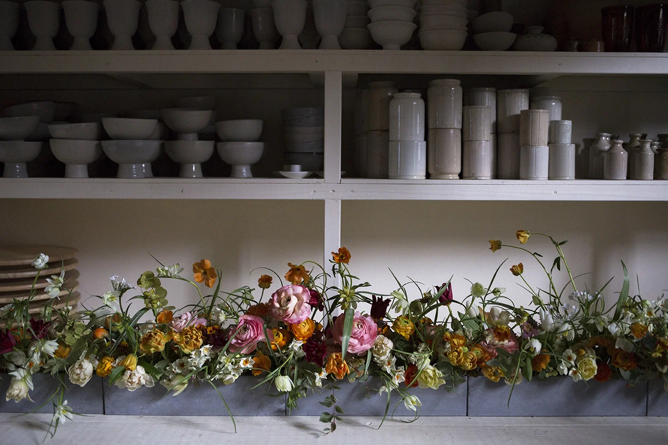Pops of colour for a spring drinks party in Soho; one and a half metres of tulips, Cornish narcissi,and alliums, with butterfly ranunculus and Fritillaria Uva Vulpis & Meleagris dancing above.