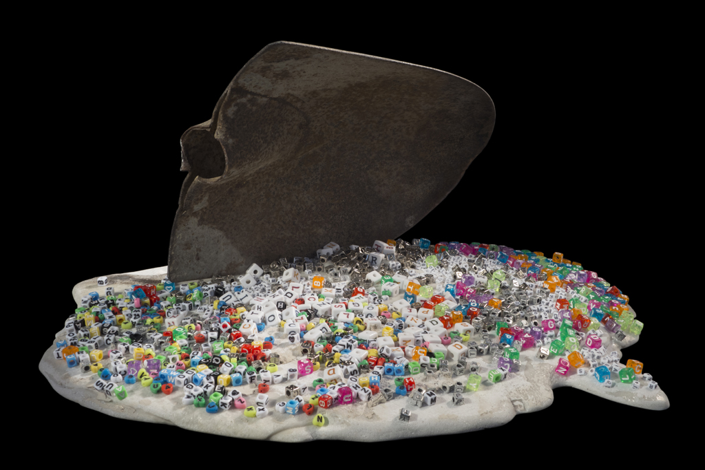 Heed, 2013, iron shovel blade, cast marble, plastic and metal letter beads, 19x9x16 inches