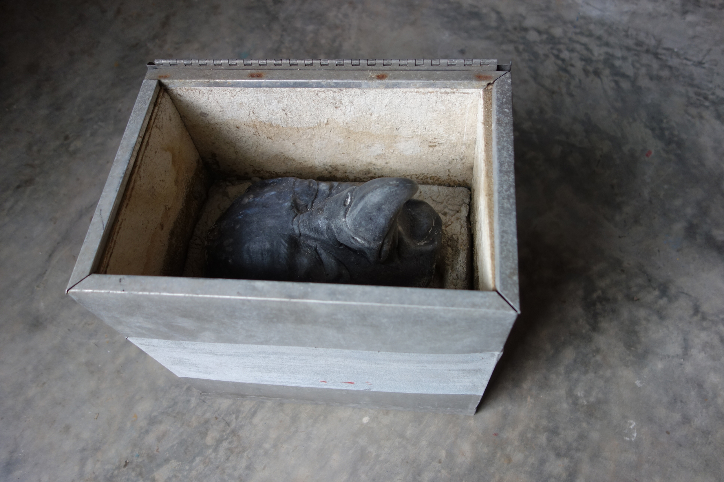 RETURN TO SENDER V, 2015, cast cultured granite, cement and metal box