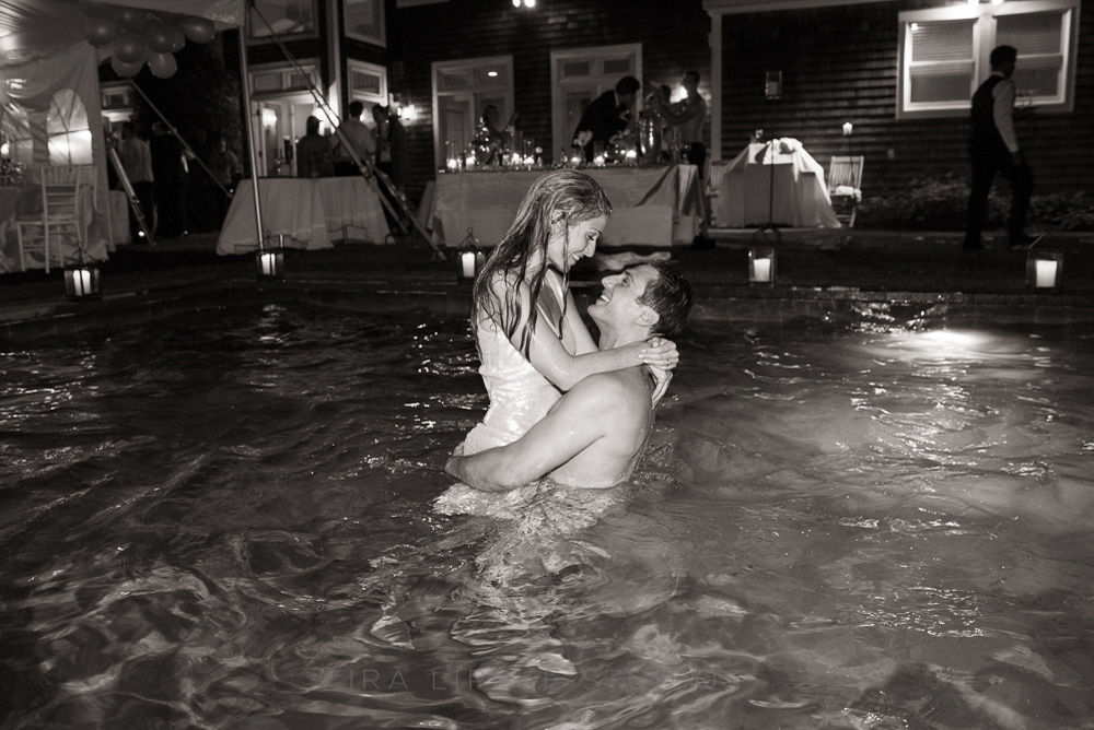 bride-groom-pool-party-kissing-bw