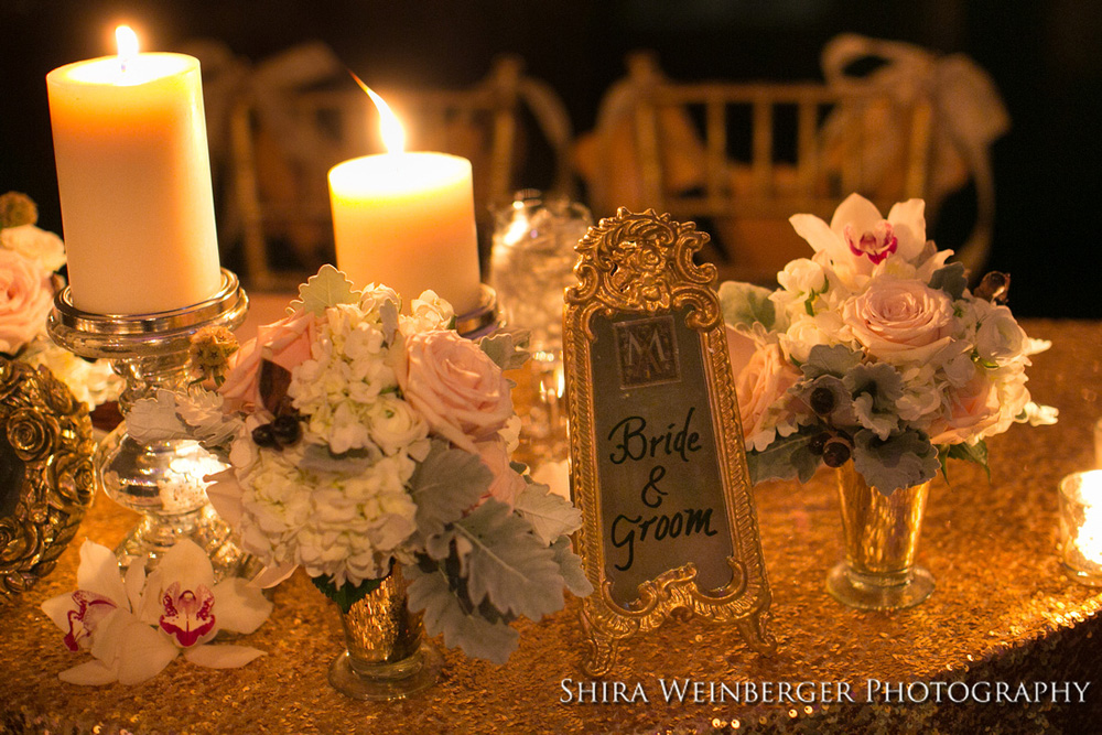 wedding-centerpiece-pillar-candles-white-flowers-sophisticated-glamorous