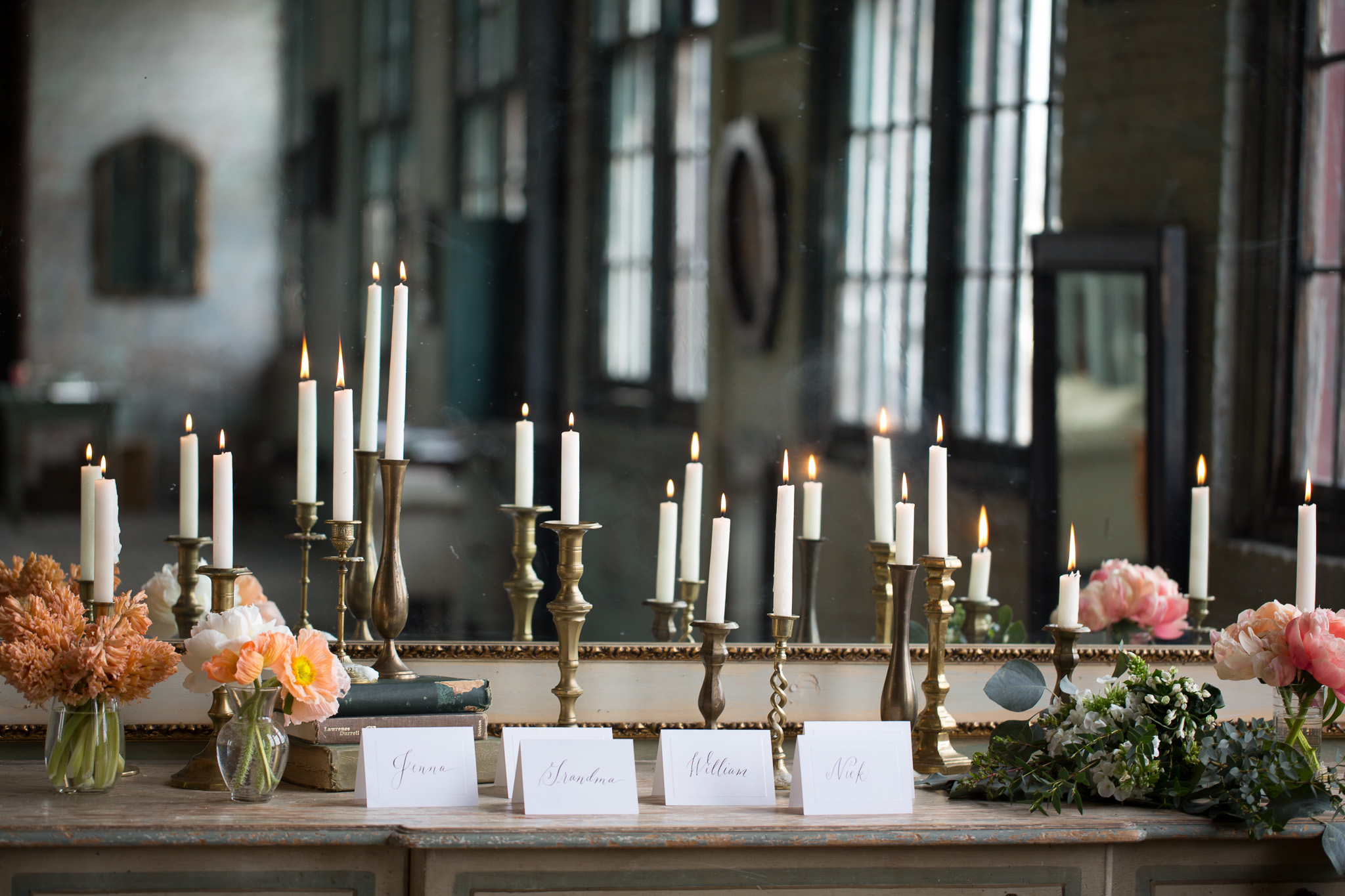 gorgeous-escort-card-display-taper-candles-brass-peach-coral-flowers